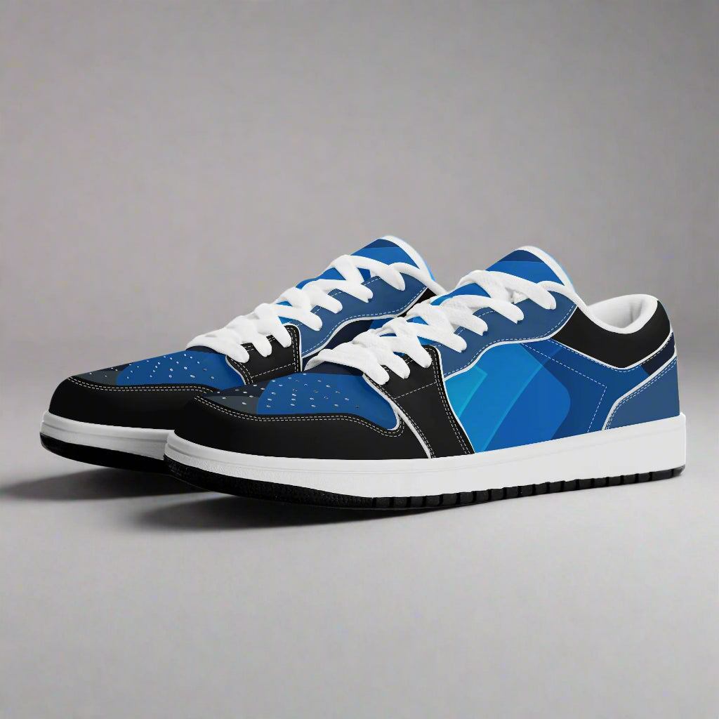 Blue and black sneakers with white laces on a white background
