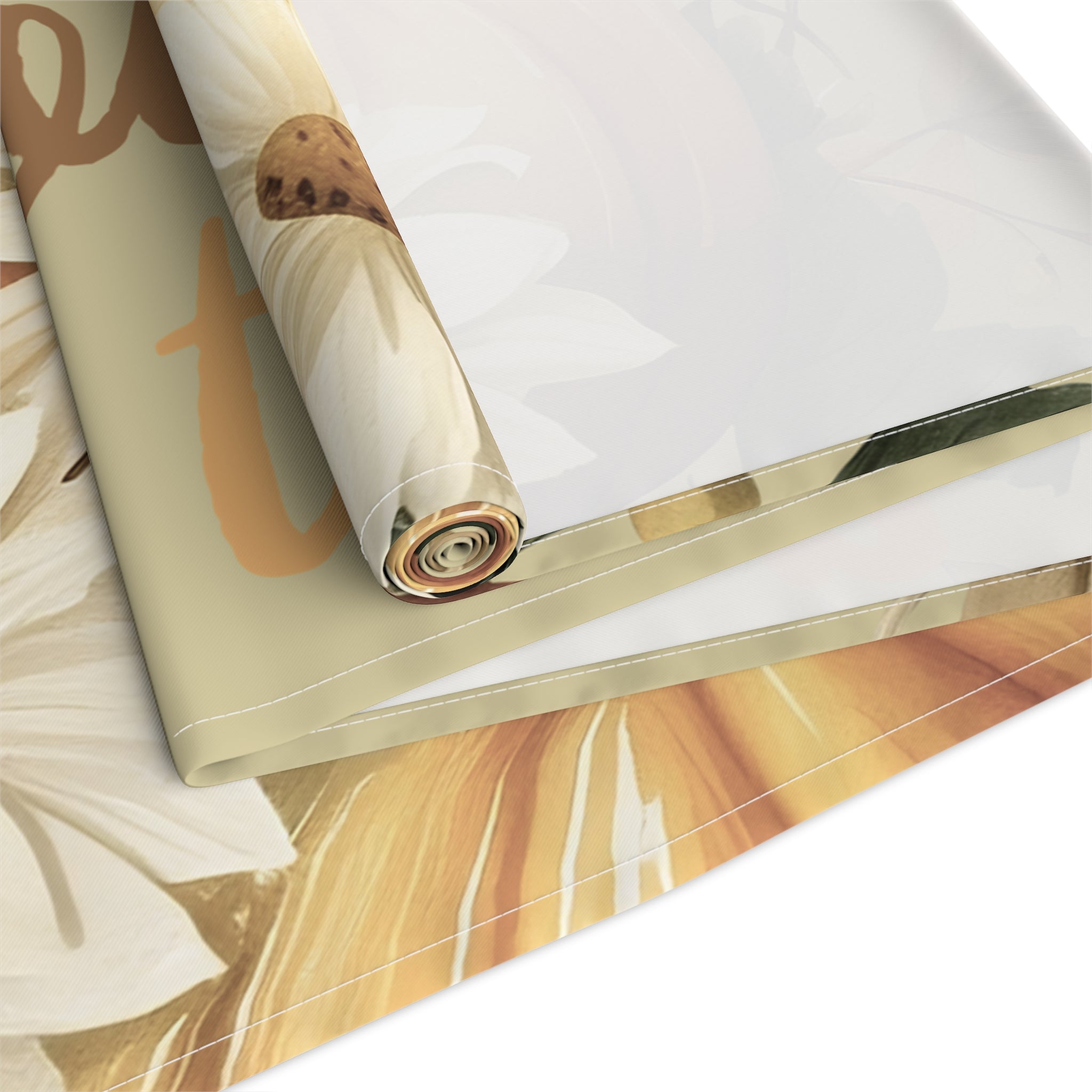 Roll of marbled paper with gold accents on a white surface
