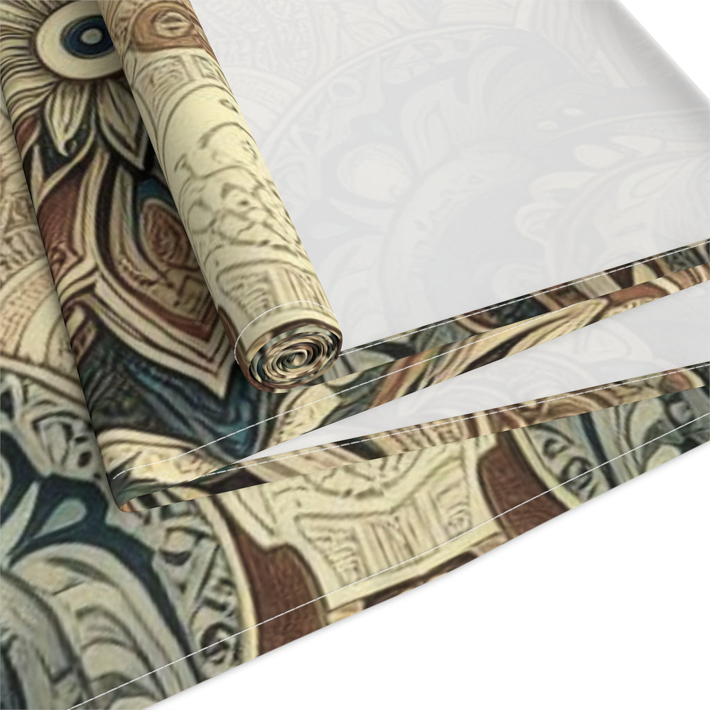Roll of patterned fabric with intricate designs on a white background