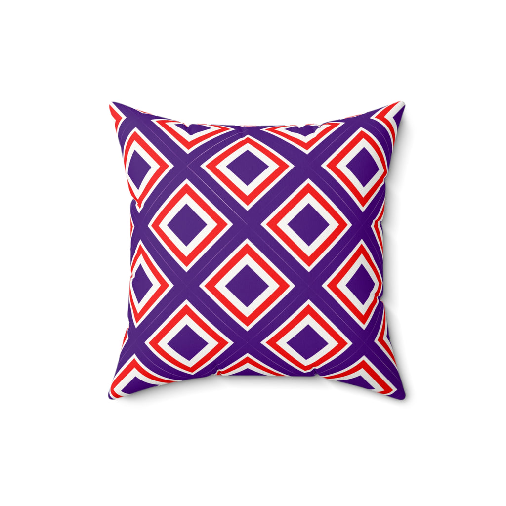 Decorative pillow with red and purple geometric pattern on a white background