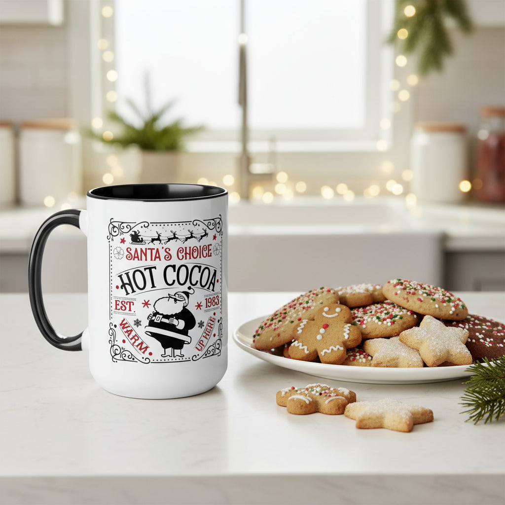White mug with black interior and handle, featuring a Santa-themed design, on a table with cookies.