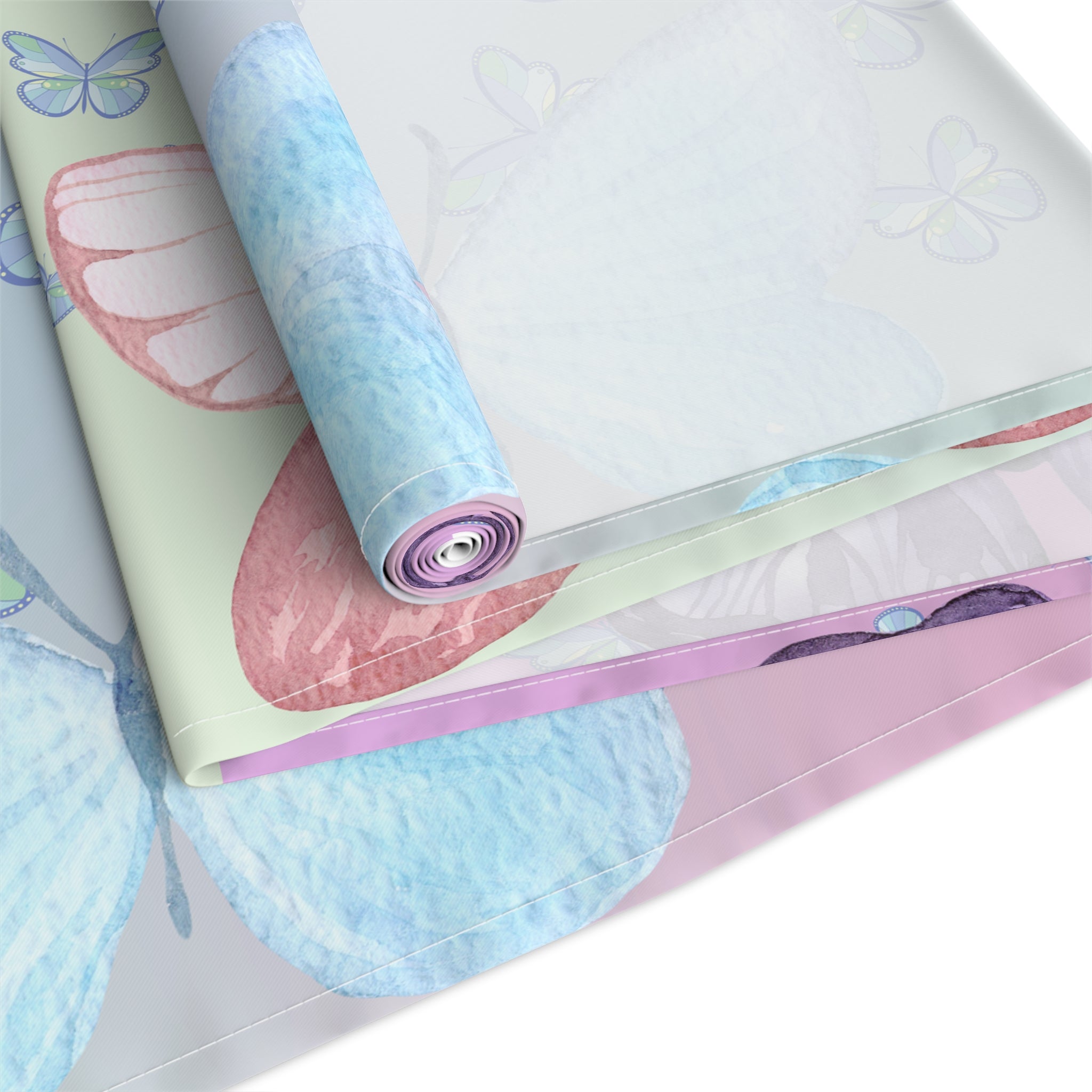 Roll of decorative paper with butterfly designs on a white background