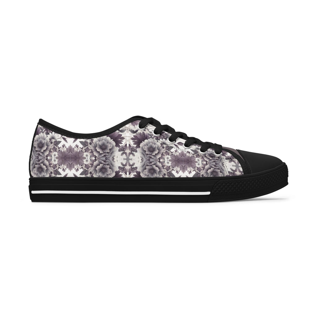 Black sneaker with a floral pattern on a white background