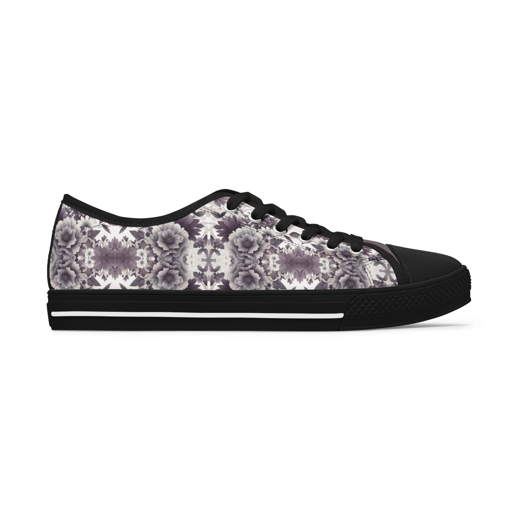 Black sneaker with a floral pattern on a white background