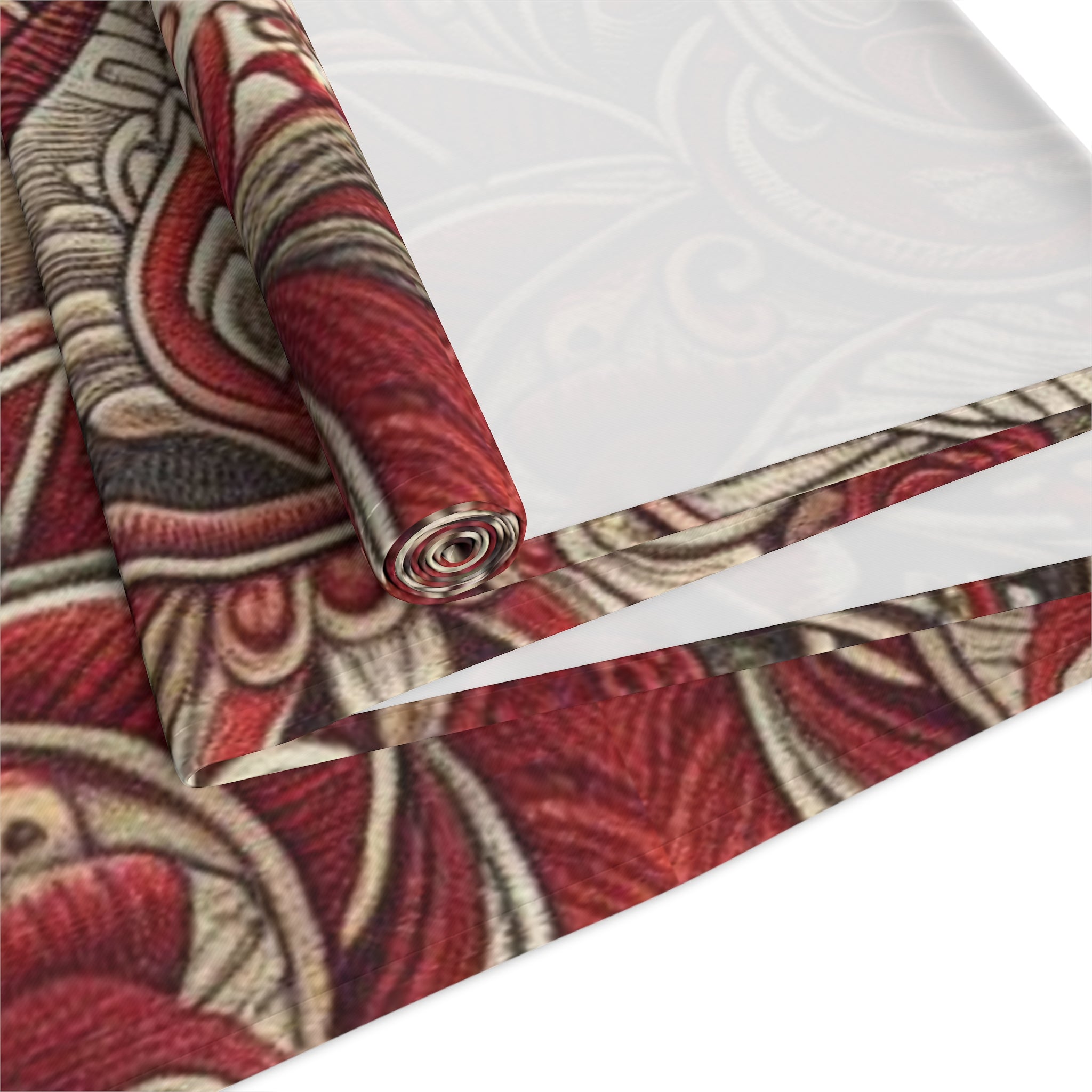 Roll of red and brown patterned fabric on a white background