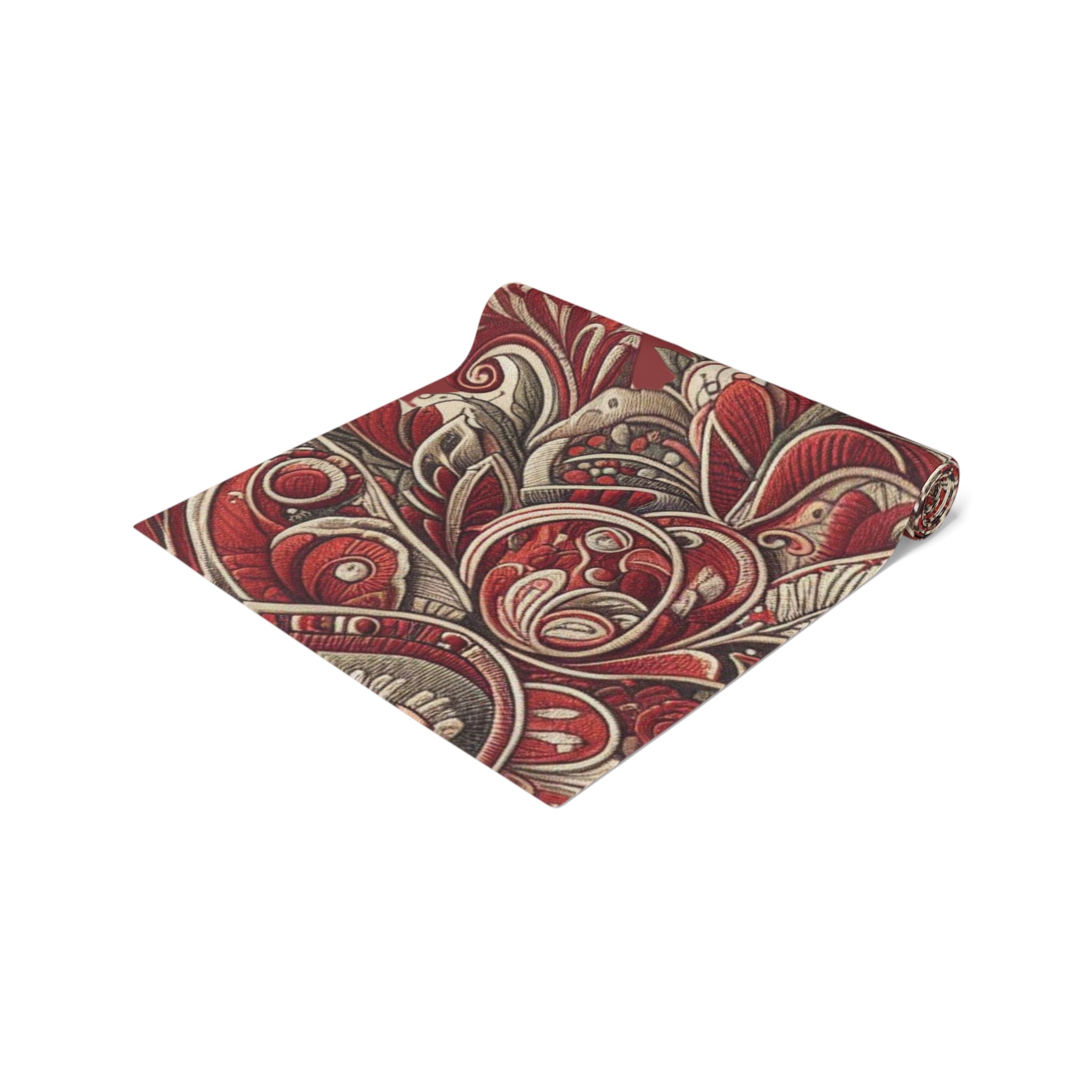 Folded fabric with intricate paisley pattern on a white background