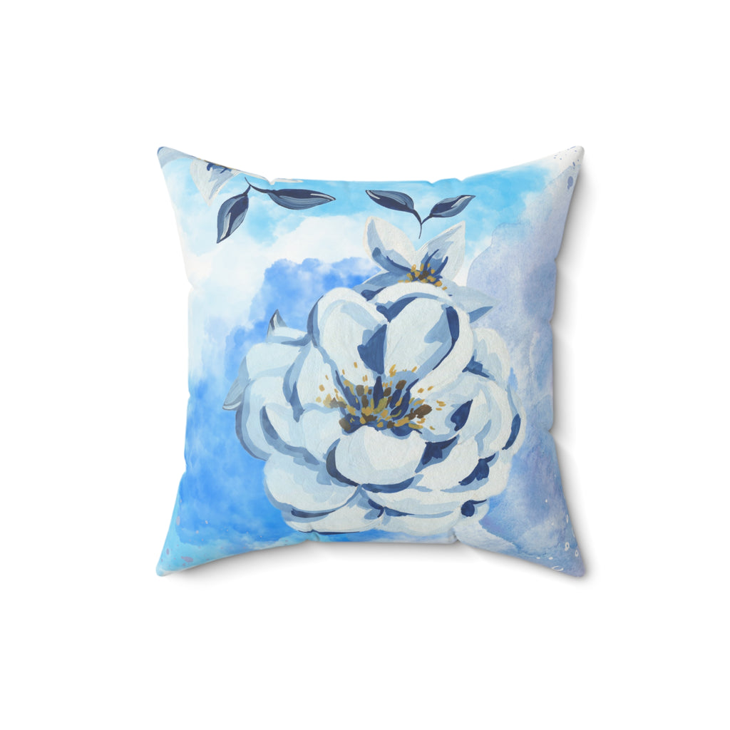 Decorative pillow with a blue and white floral design on a light blue background