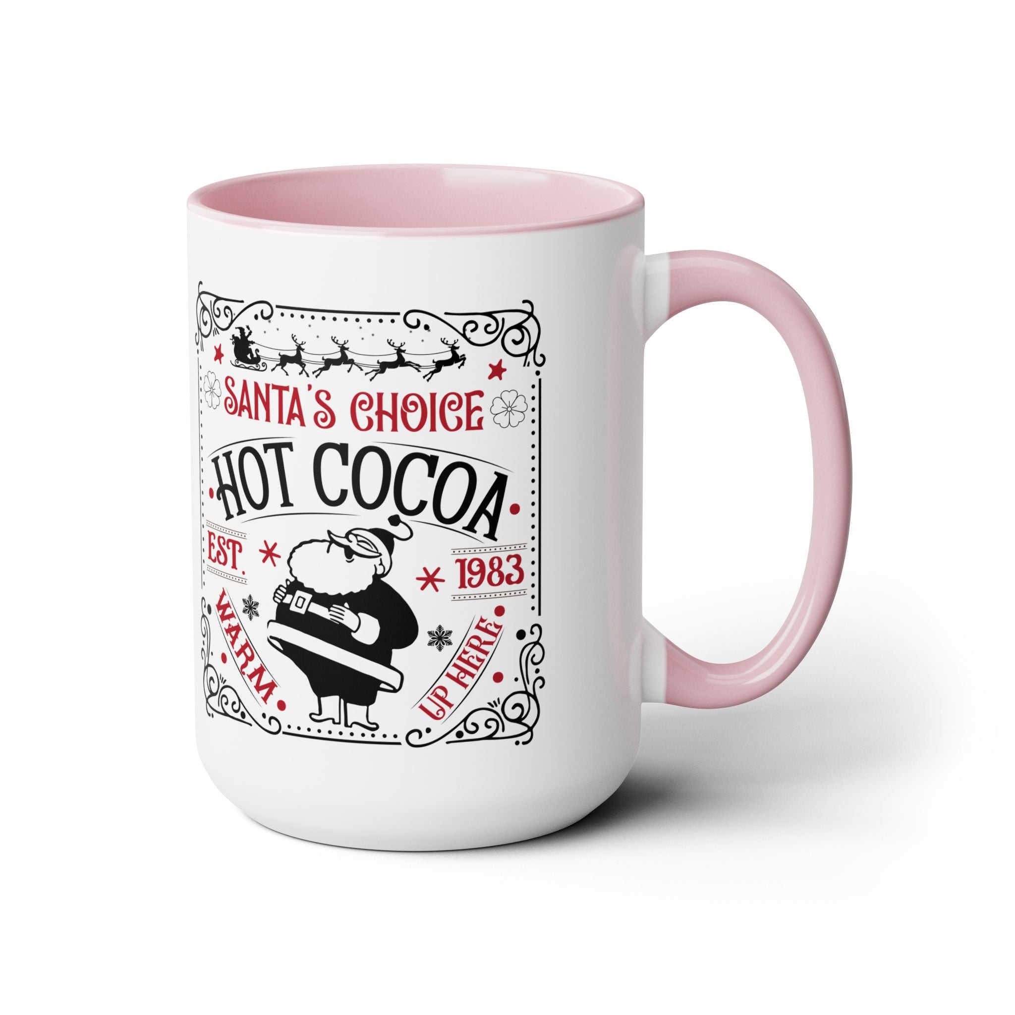 White mug with pink interior and handle featuring 'Santa's Choice Hot Cocoa' text and graphics.