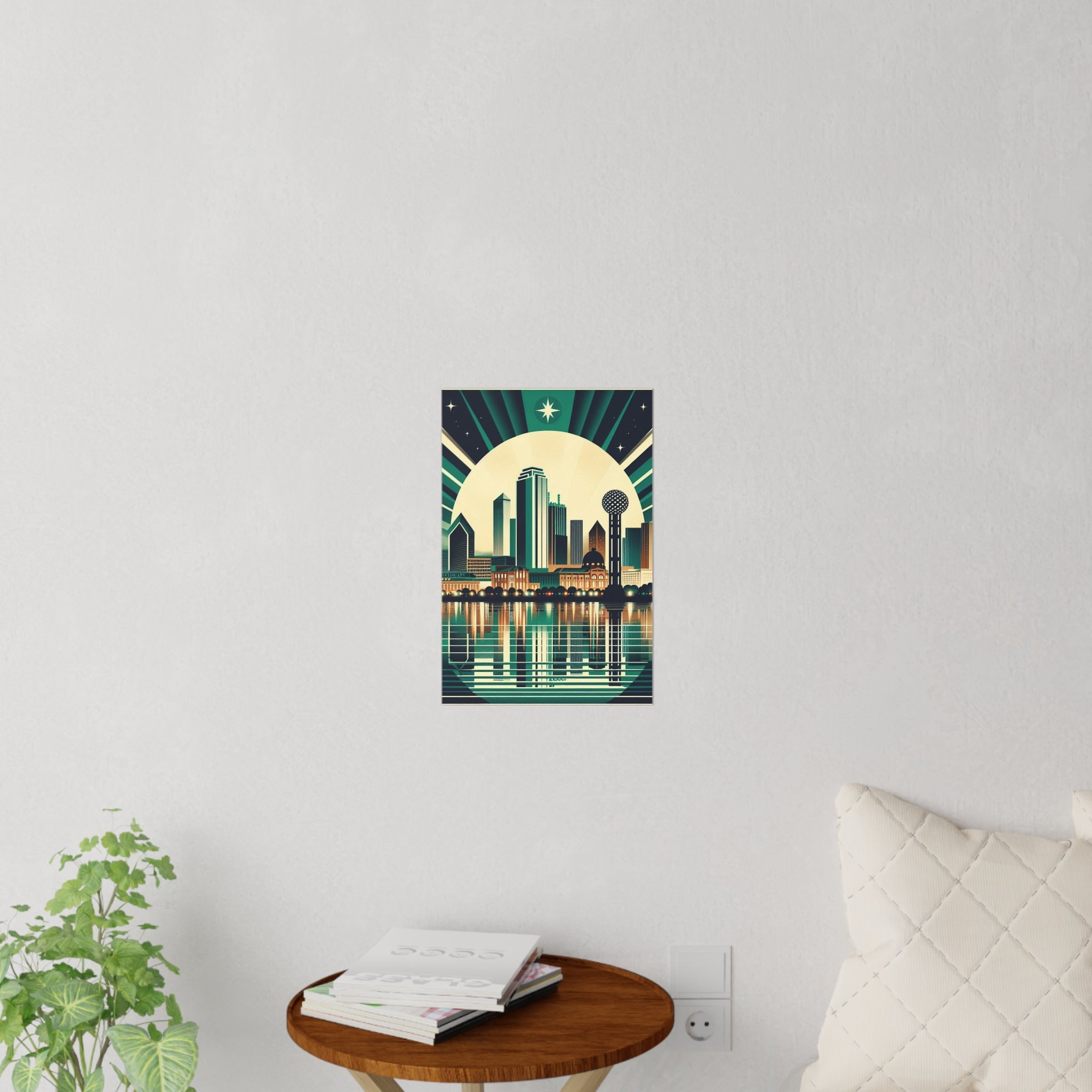 Poster of a city skyline with a starry night sky on a white wall, next to a plant and small table.