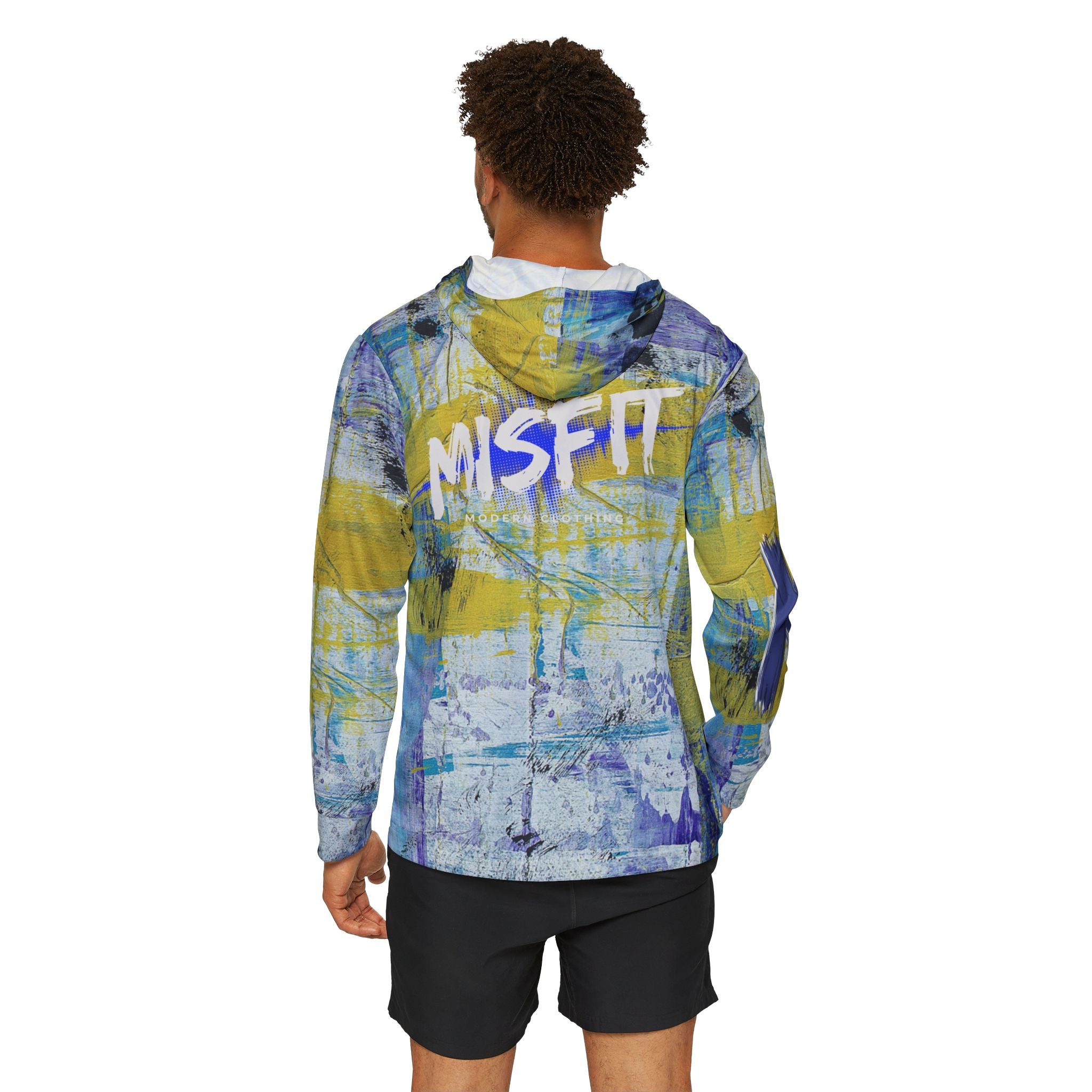 Person wearing a colorful jacket with 'MISFIT' branding on the back, standing against a white background.