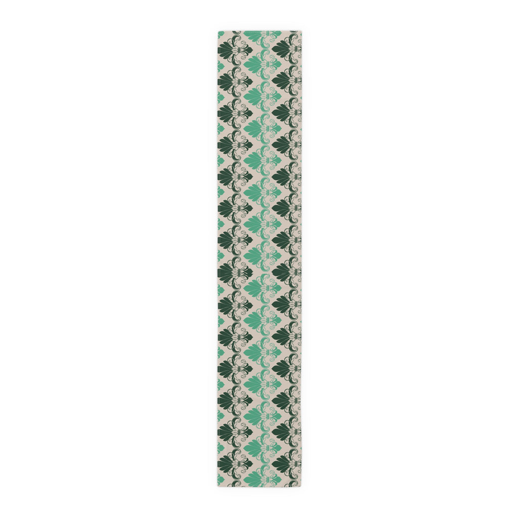 Patterned green and beige scarf on a white background