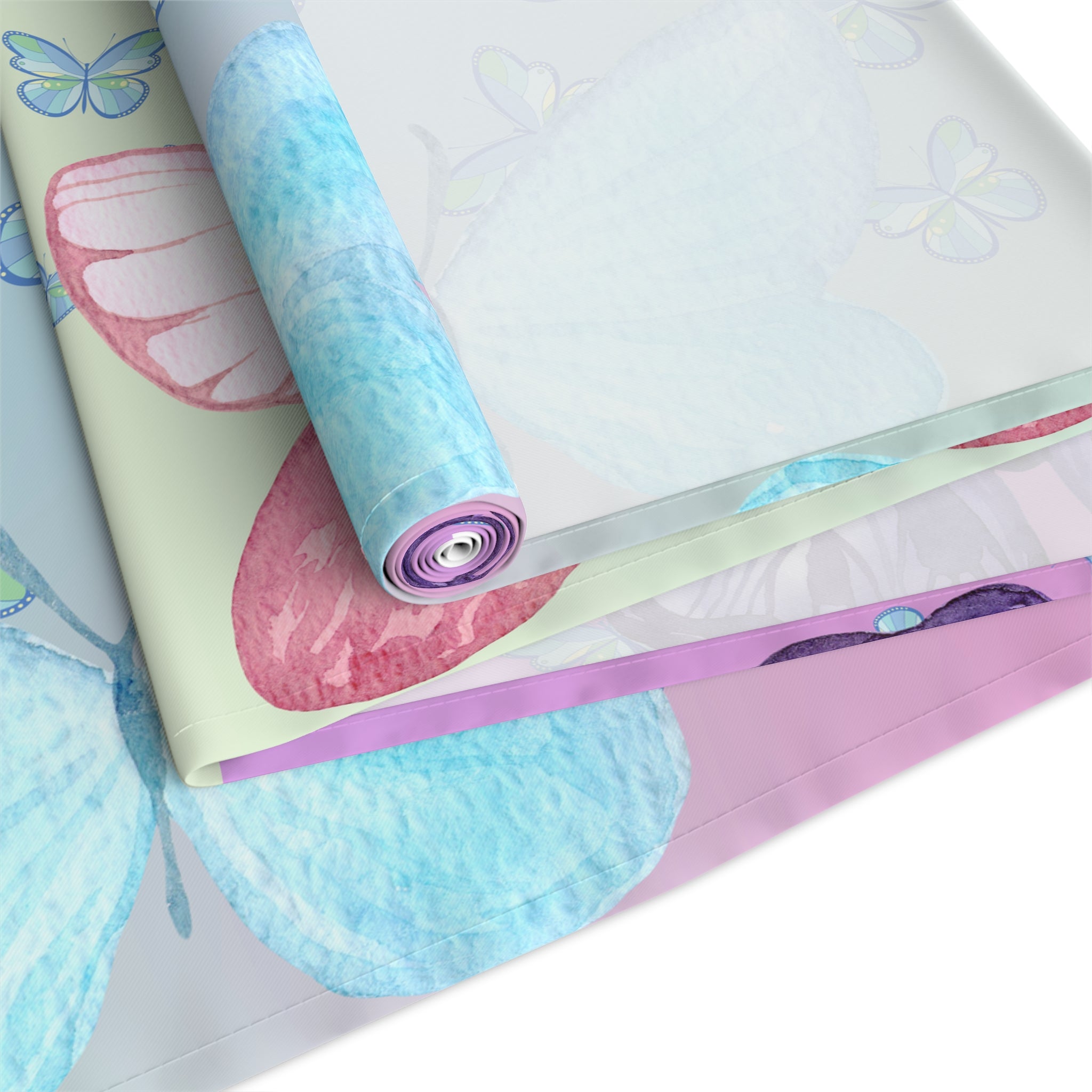 Roll of colorful paper with butterfly designs on a white background