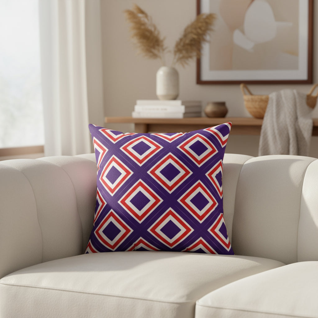 Decorative pillow with red and purple geometric pattern on a white background