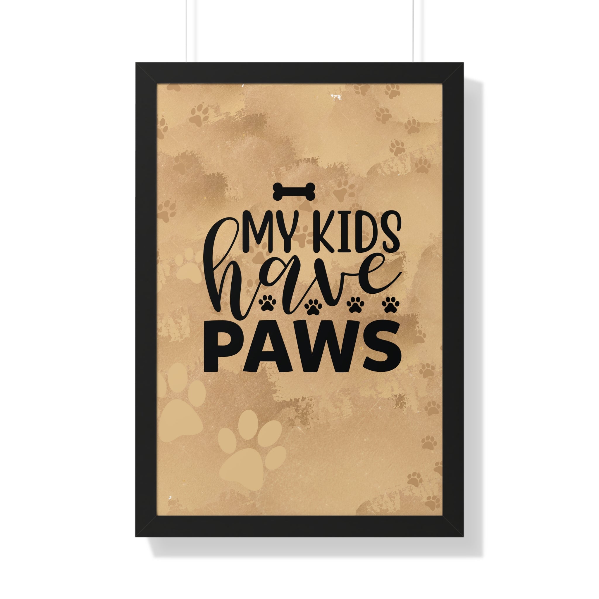 Framed print with 'My kids have paws' text on a brown background with paw prints.