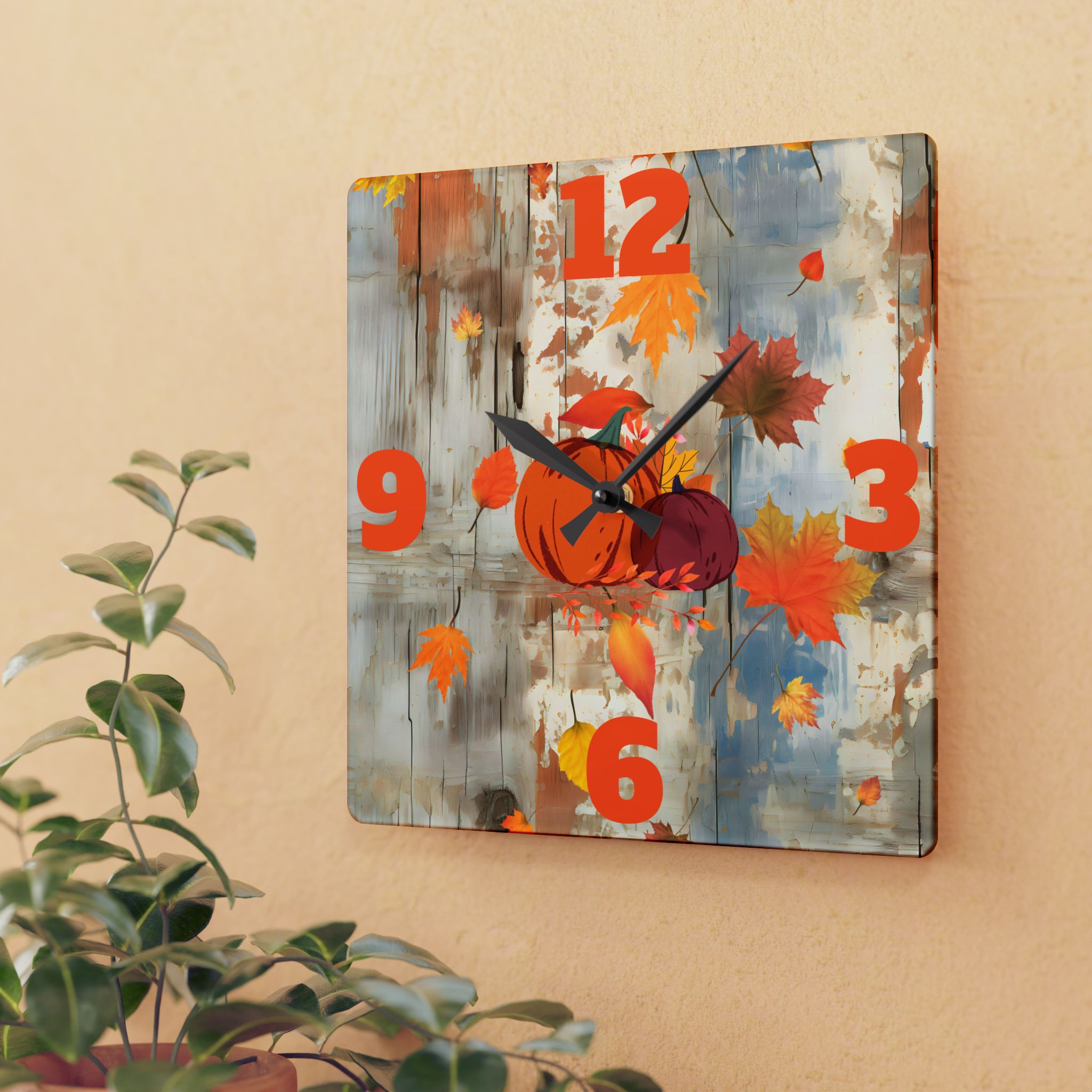 Decorative wall clock with autumn design featuring pumpkins and leaves on a wooden background.