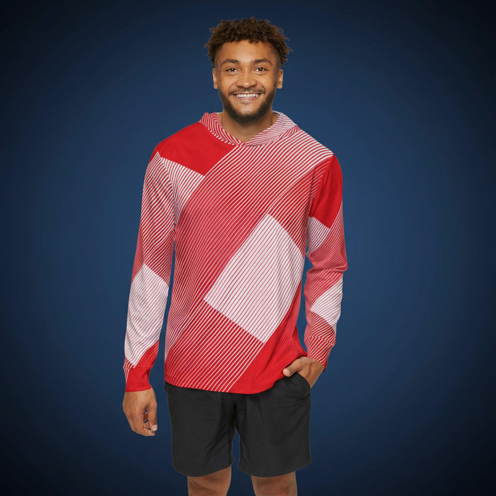 Man wearing a red and white patterned shirt against a blue background