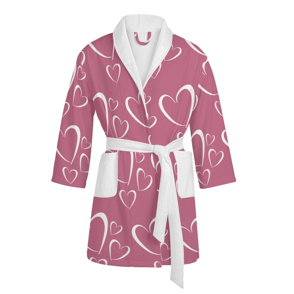 Pink robe with white heart pattern on a white background