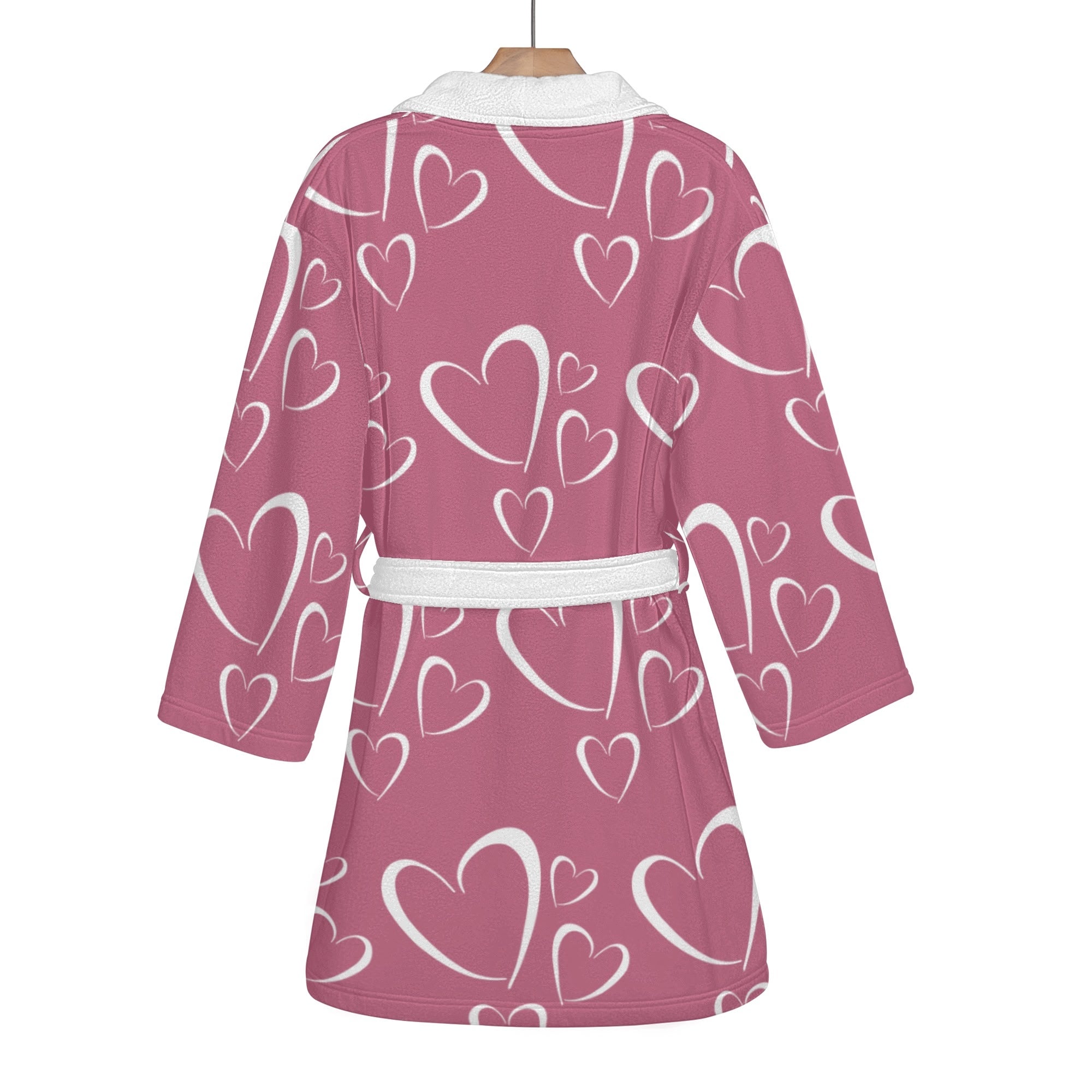 Pink robe with white heart patterns on a white background