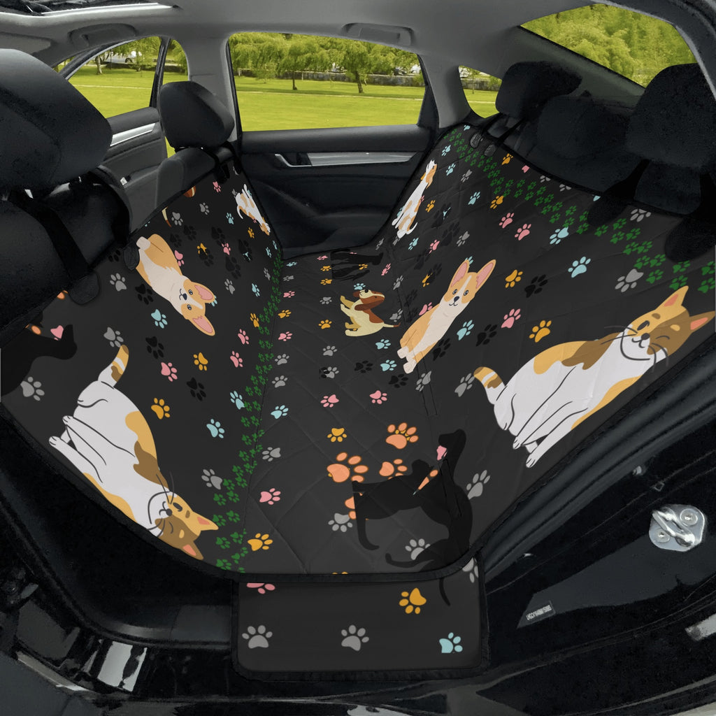 Car seat cover with corgi pattern and paw prints on a black background
