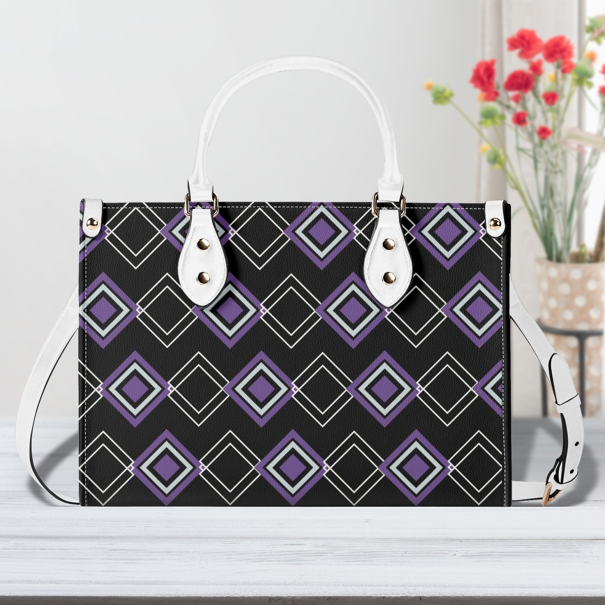 Handbag with geometric pattern on a white surface with flowers in the background