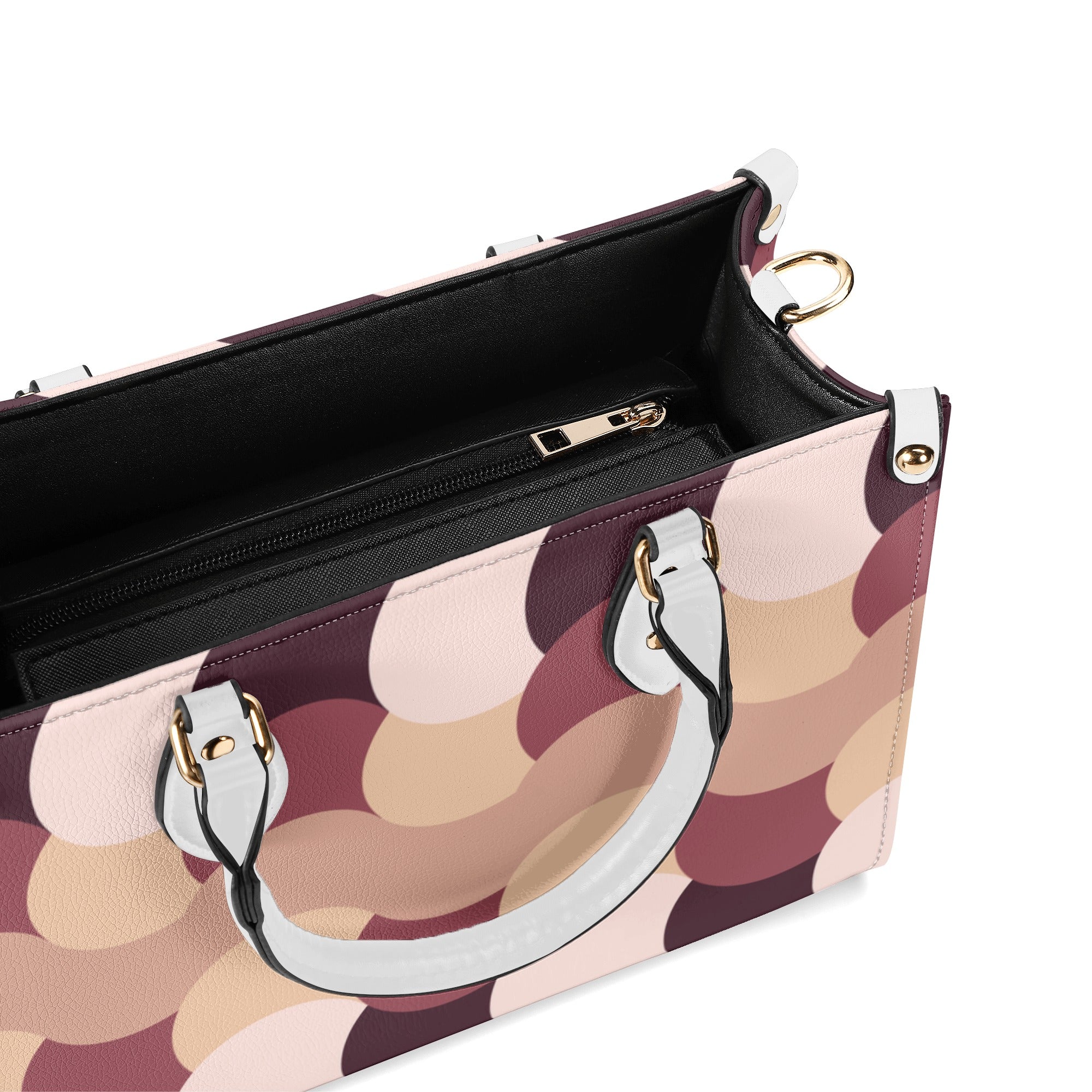 Patterned handbag with gold hardware on a white background