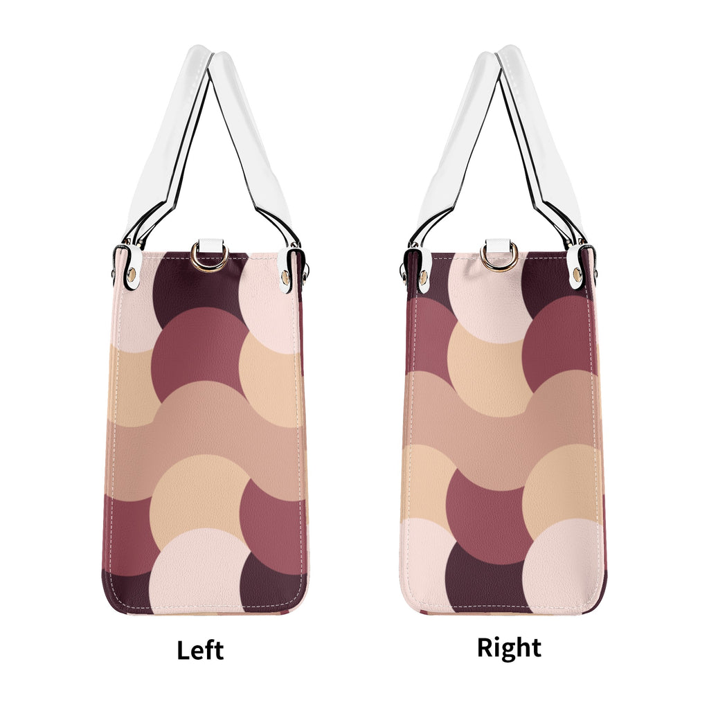 Two identical handbags with a circular pattern on a white background