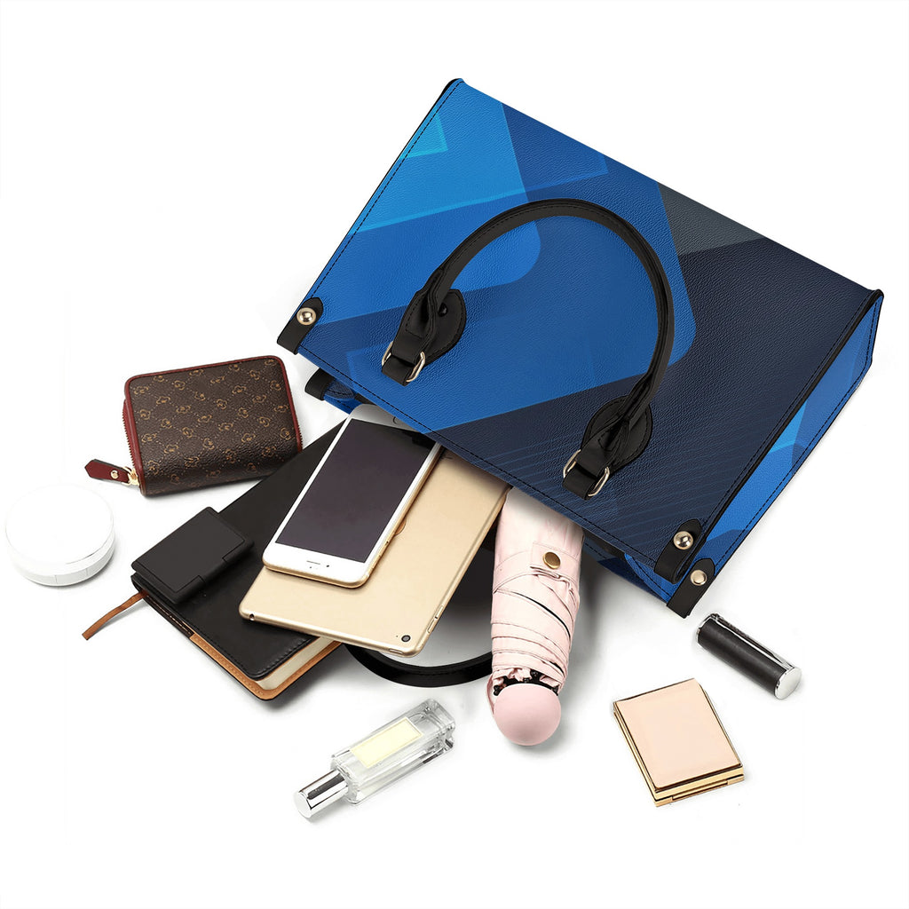 Blue handbag with various accessories including a phone, wallet, and lip balm on a white background