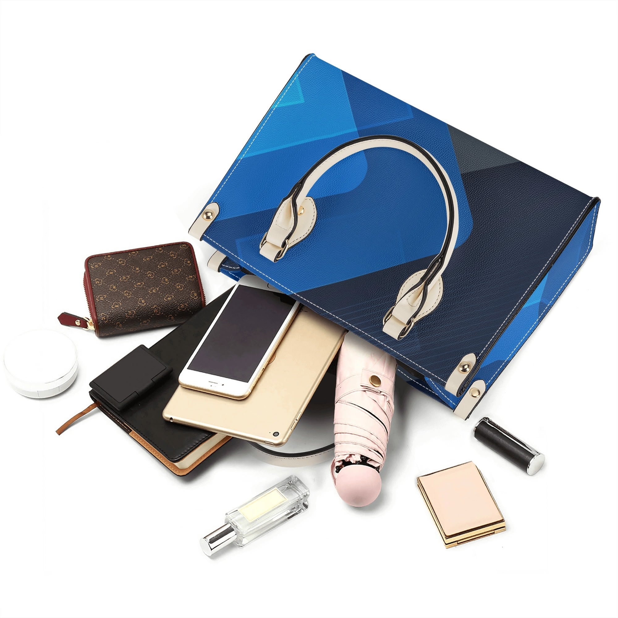 Blue handbag with various accessories including a phone, wallet, and perfume on a white background