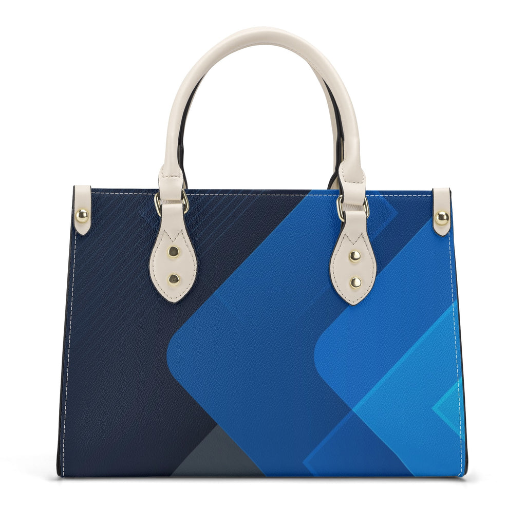 Blue and navy handbag with white handles on a white background