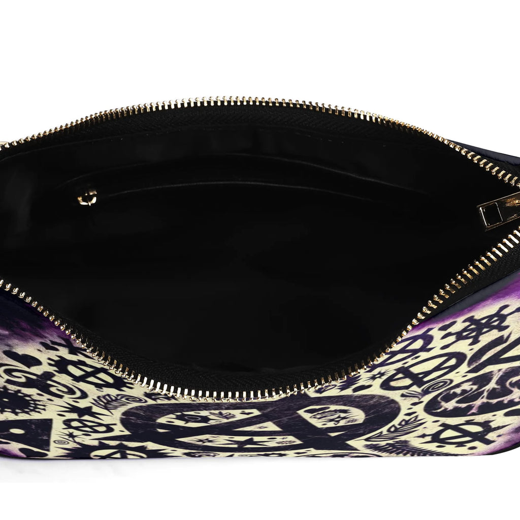 Close-up of a black handbag with a patterned interior on a white background