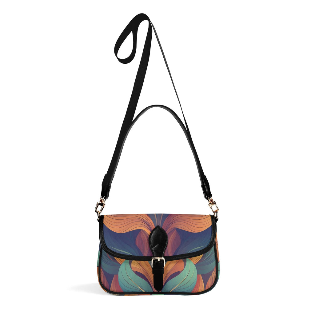 Multicolored patterned handbag with a black strap on a white background