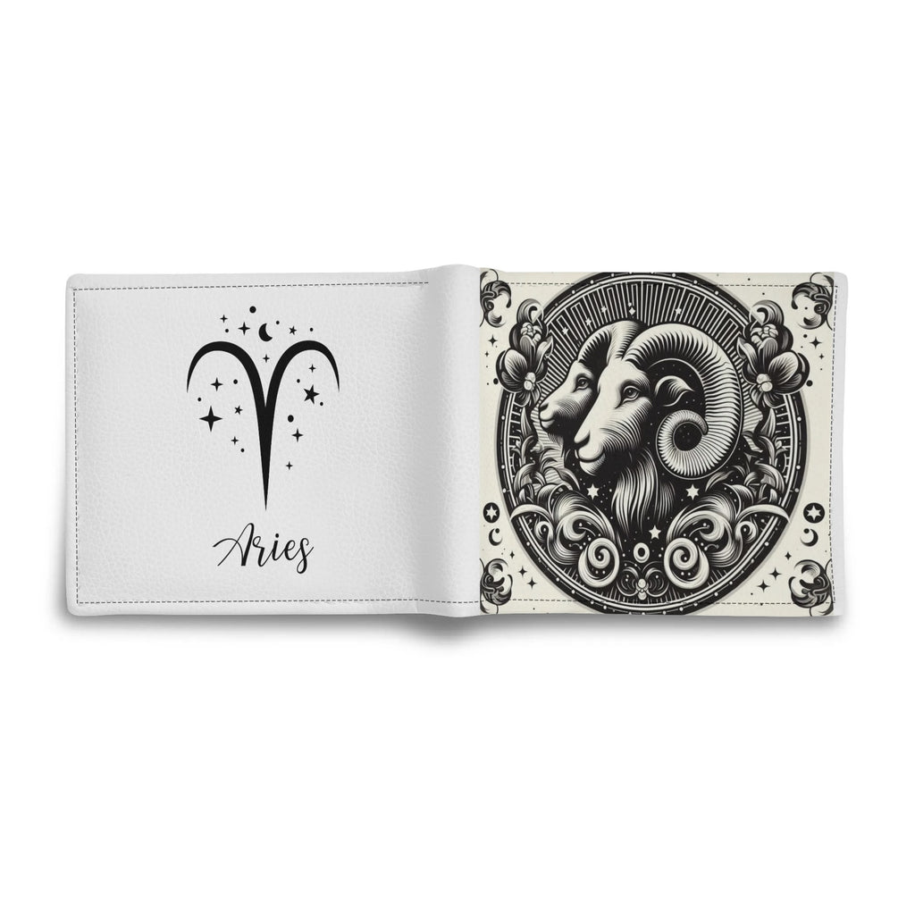 Open book with Aries zodiac design on a white background