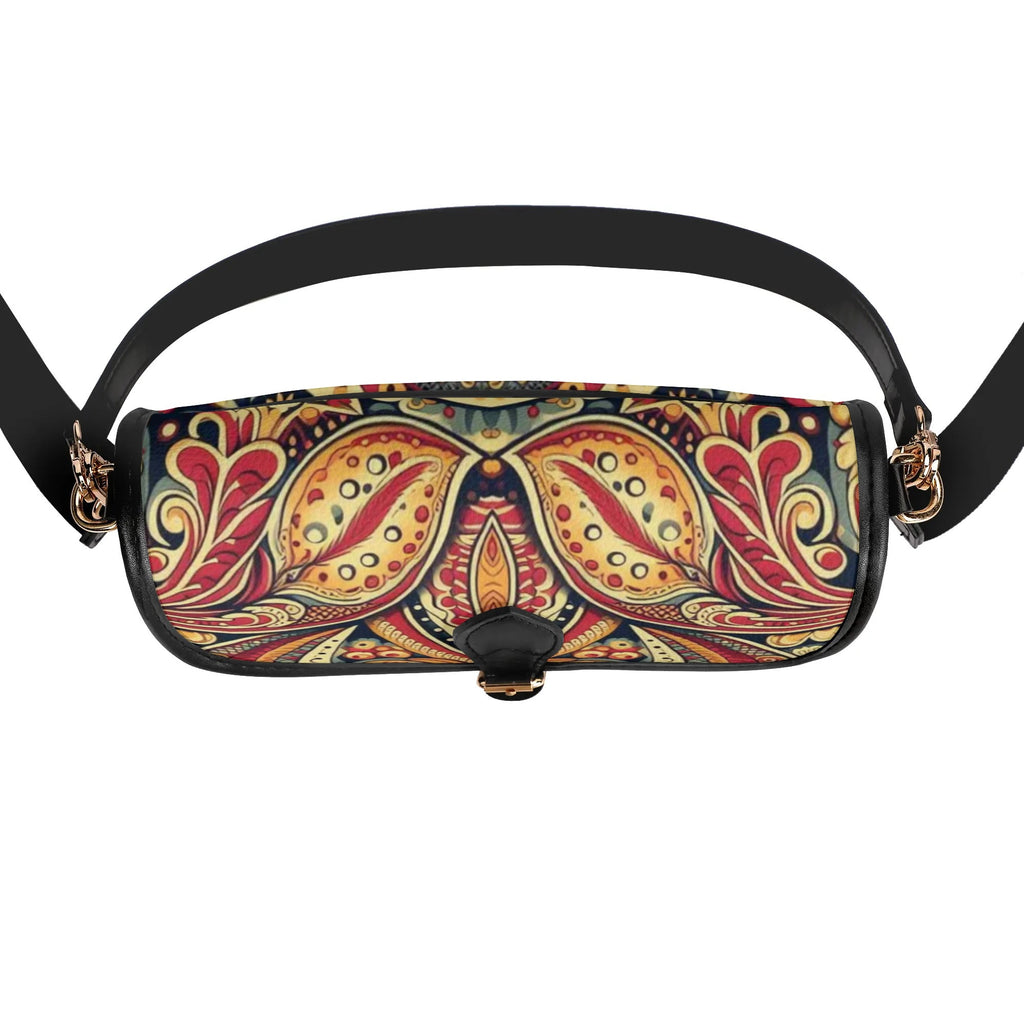 Colorful paisley patterned handbag with a black strap on a white background