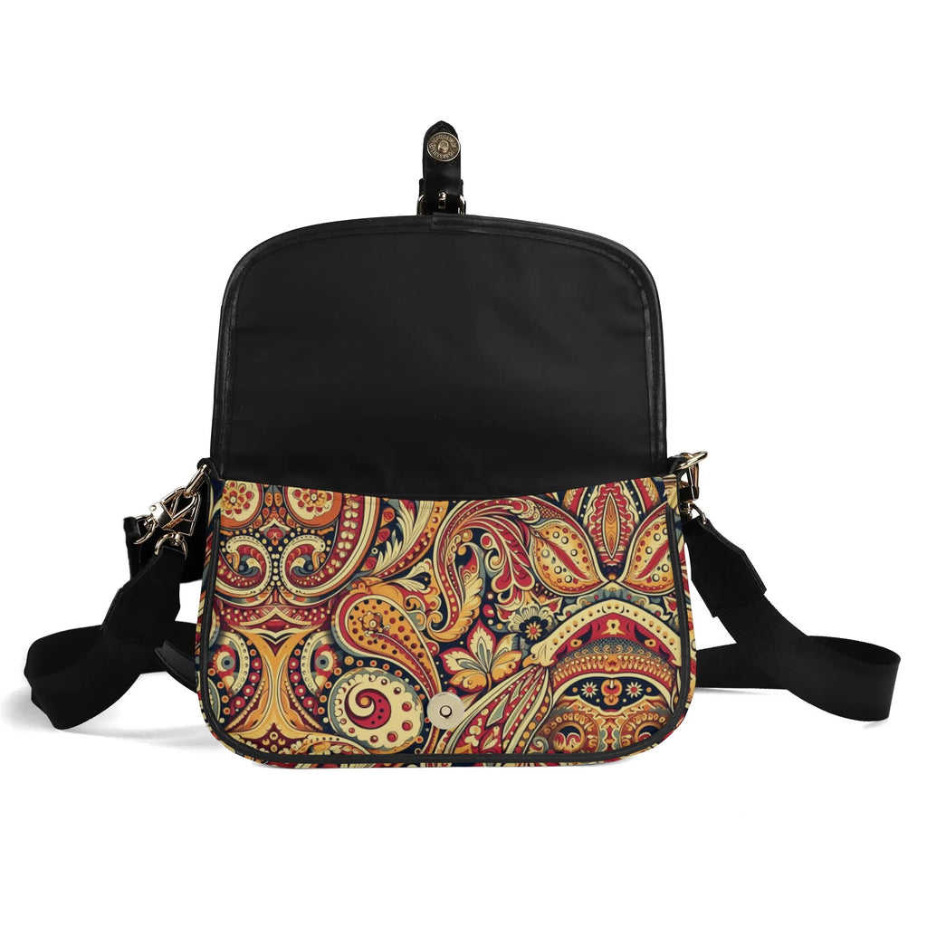 Black crossbody bag with a colorful paisley pattern on a white background