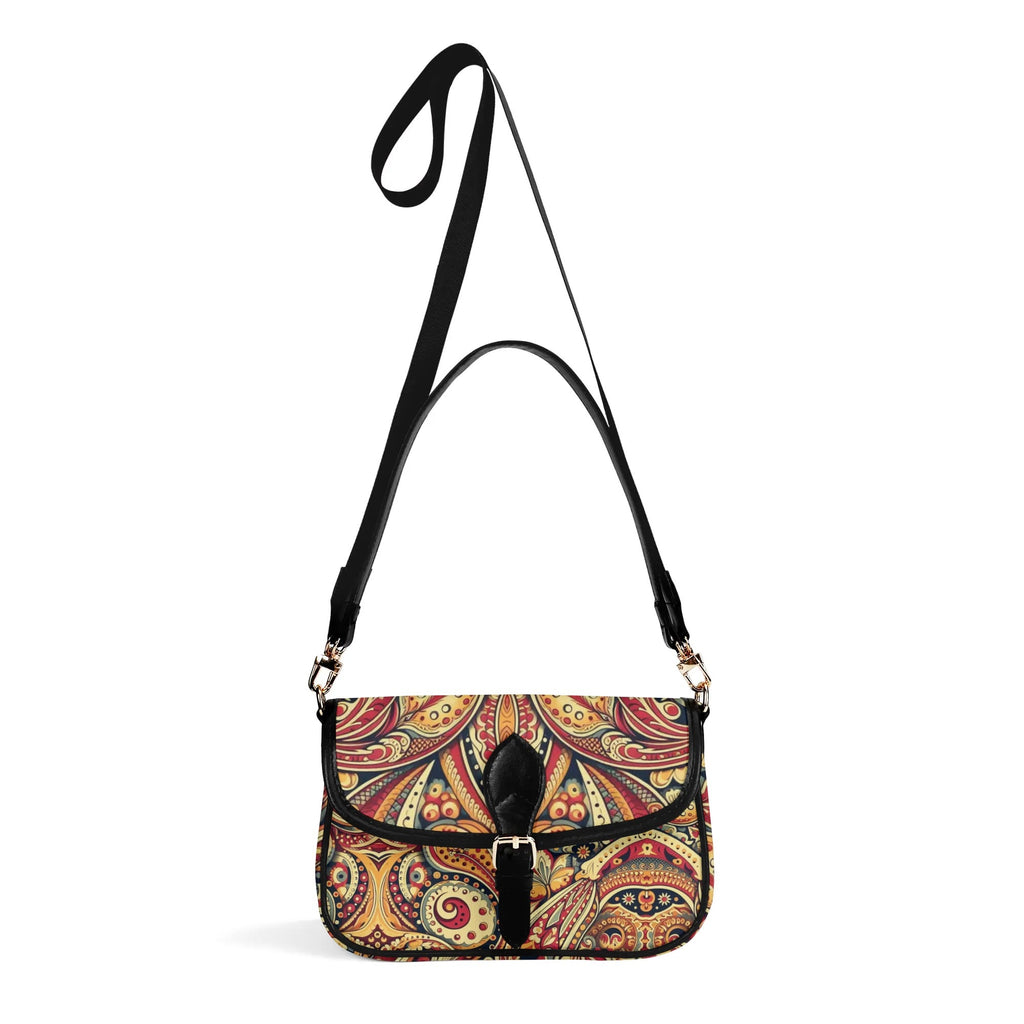Multicolored patterned handbag with a black strap on a white background