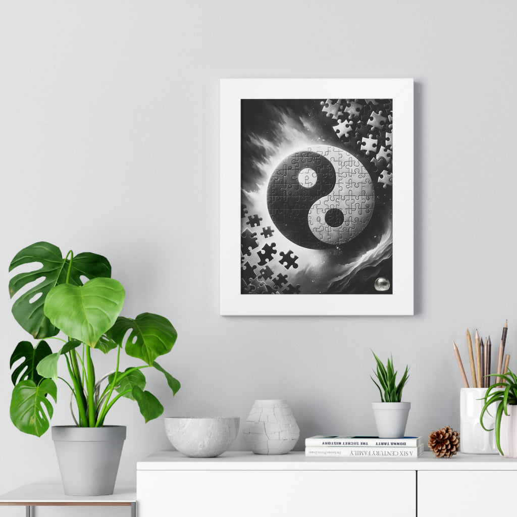 Framed artwork with a yin yang symbol and puzzle pieces on a wall above a white cabinet with decorative items.