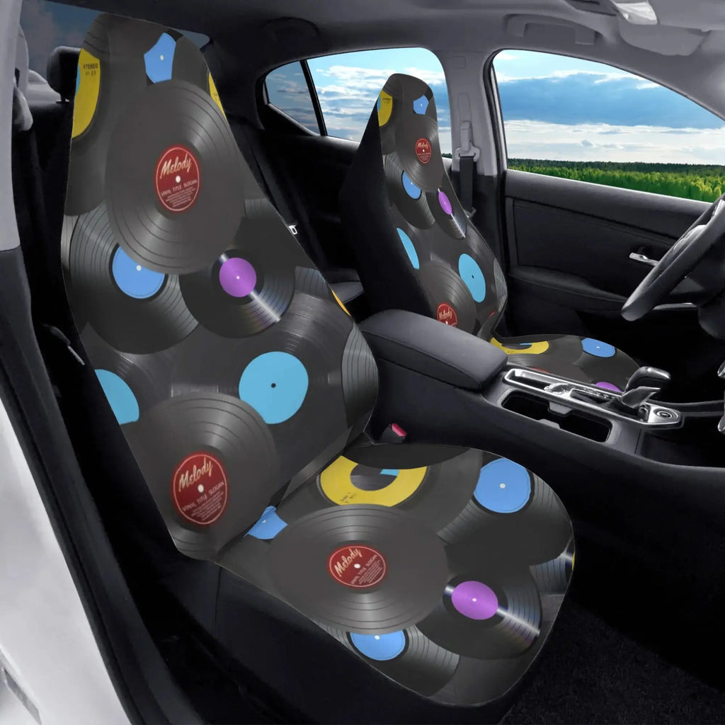 Car seat covers with vinyl record design in a vehicle interior.