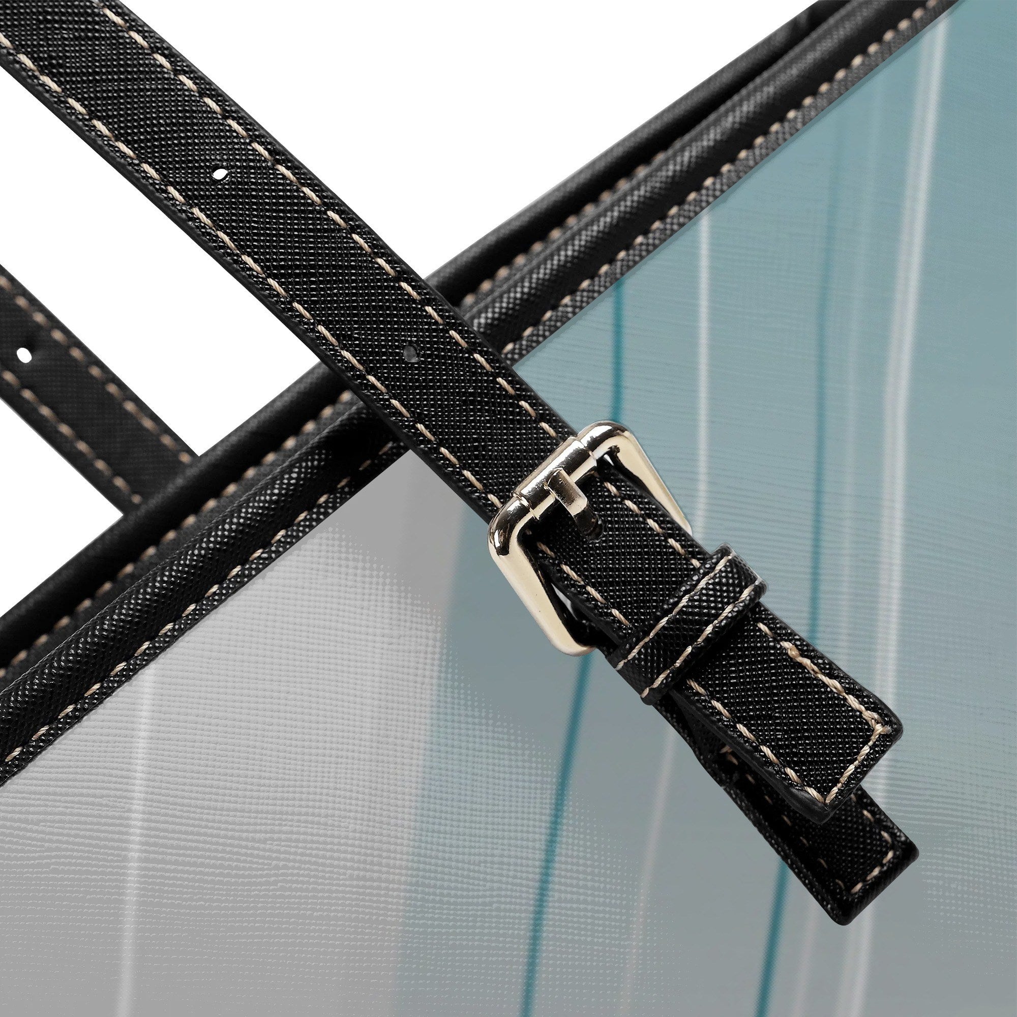 Close-up of a black strap with a silver buckle on a clear background