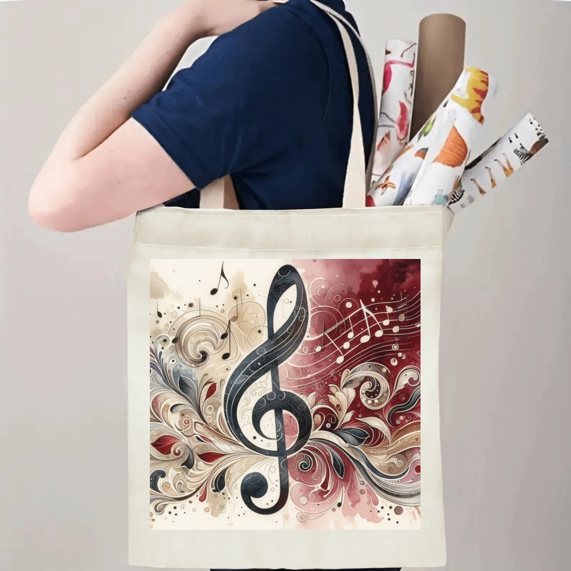 Tote bag with a decorative music note design held by a person.