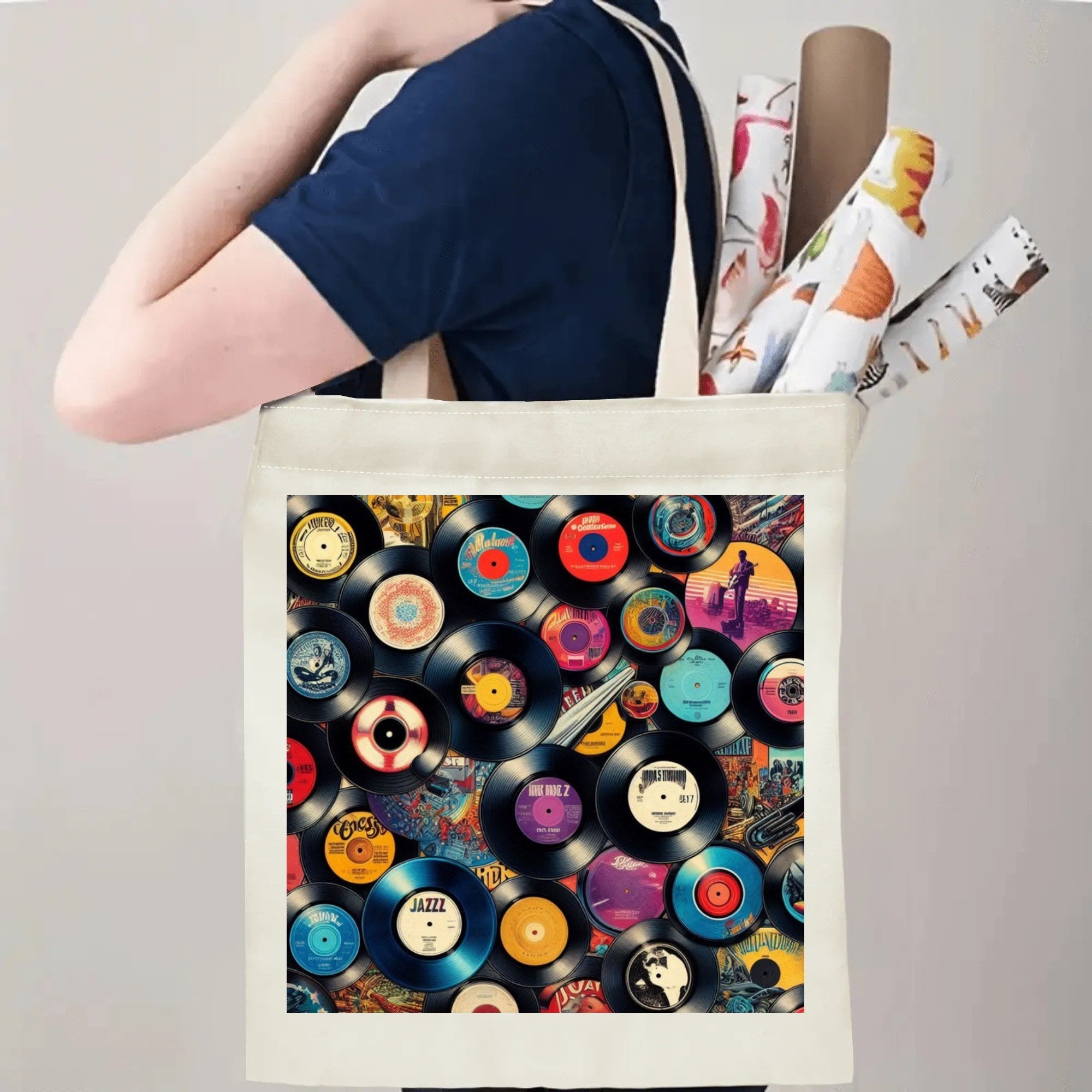 Tote bag with vinyl record design held by a person