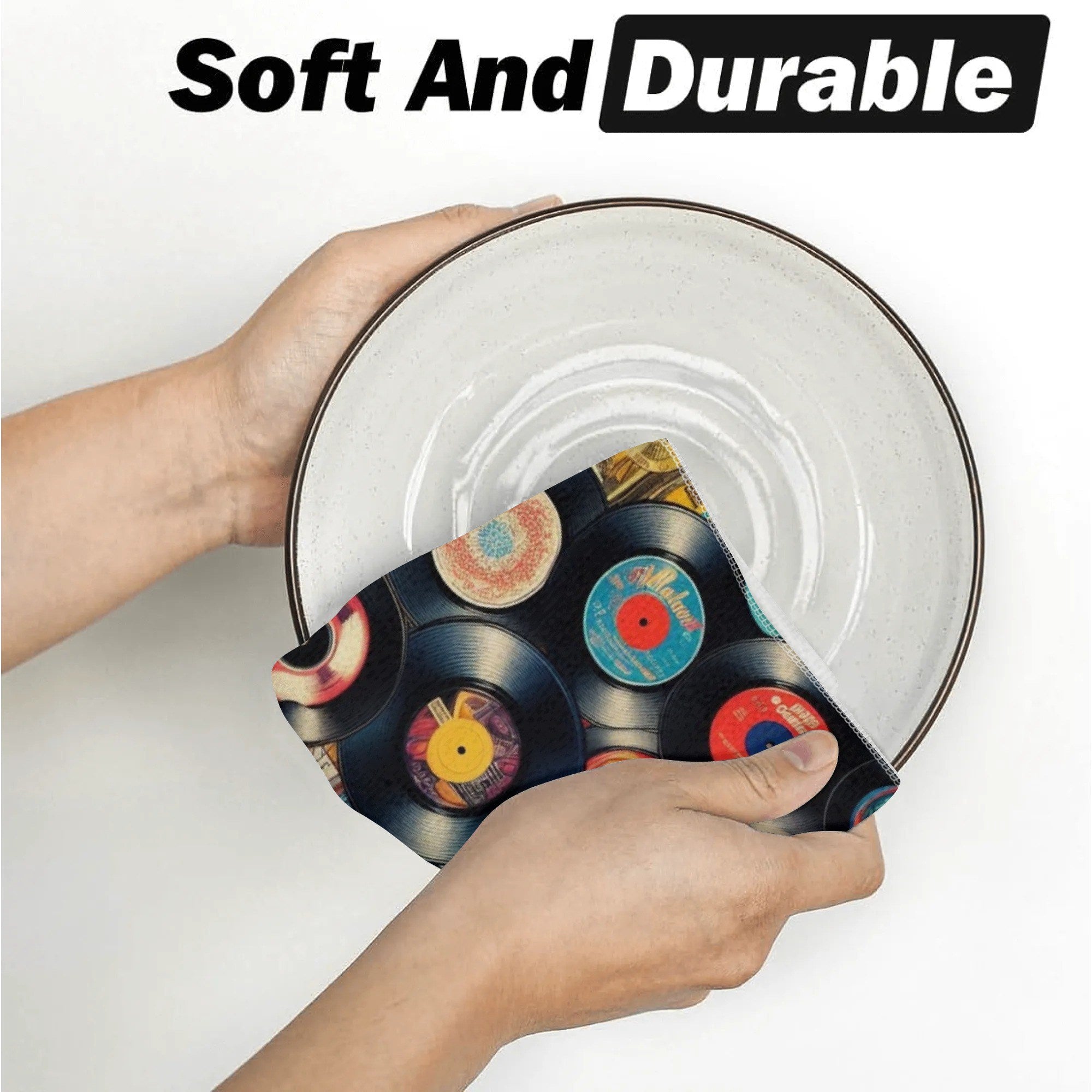 Person holding a decorative plate with vinyl record design, text 'Soft And Durable' above.