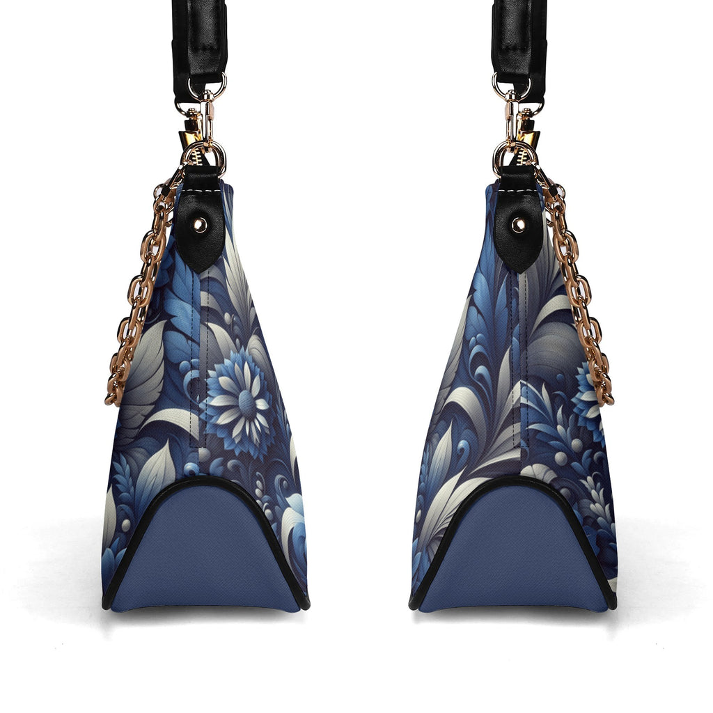 Blue floral patterned handbag with gold chain and black strap on a white background