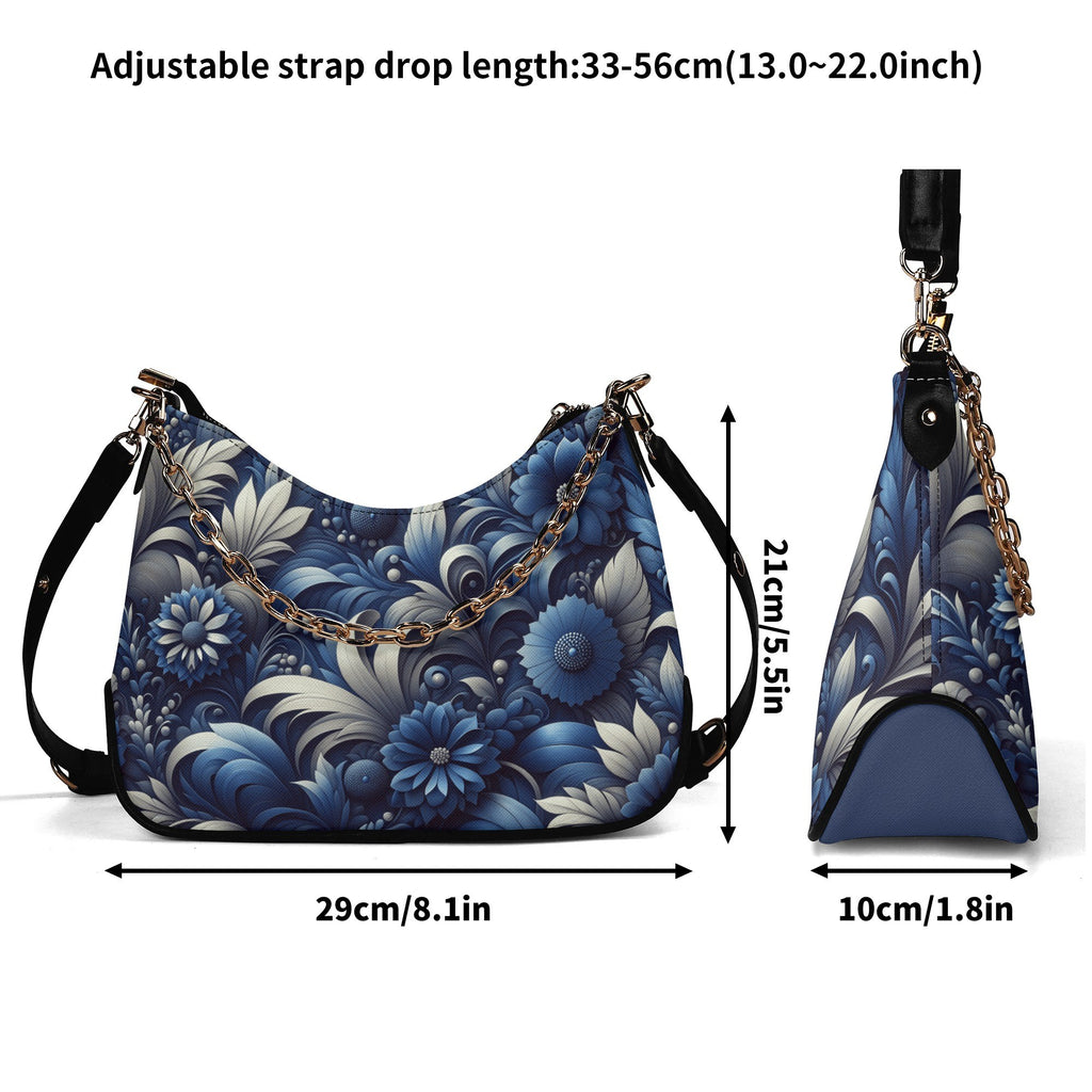 Blue floral handbag with adjustable strap measurements on a white background