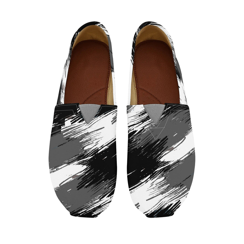 Pair of black, white, and gray abstract-patterned shoes on a white background