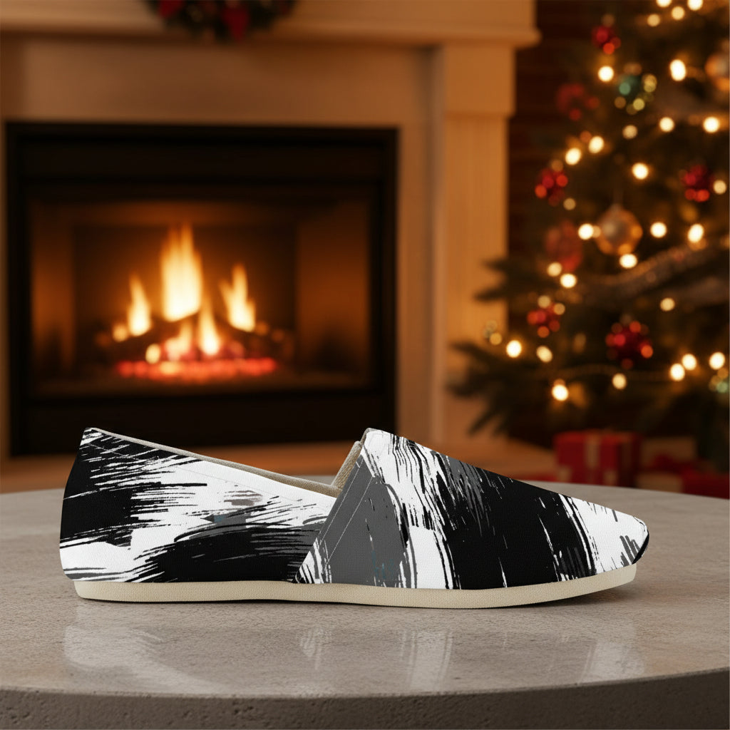 Black and white patterned flat shoe on a white background