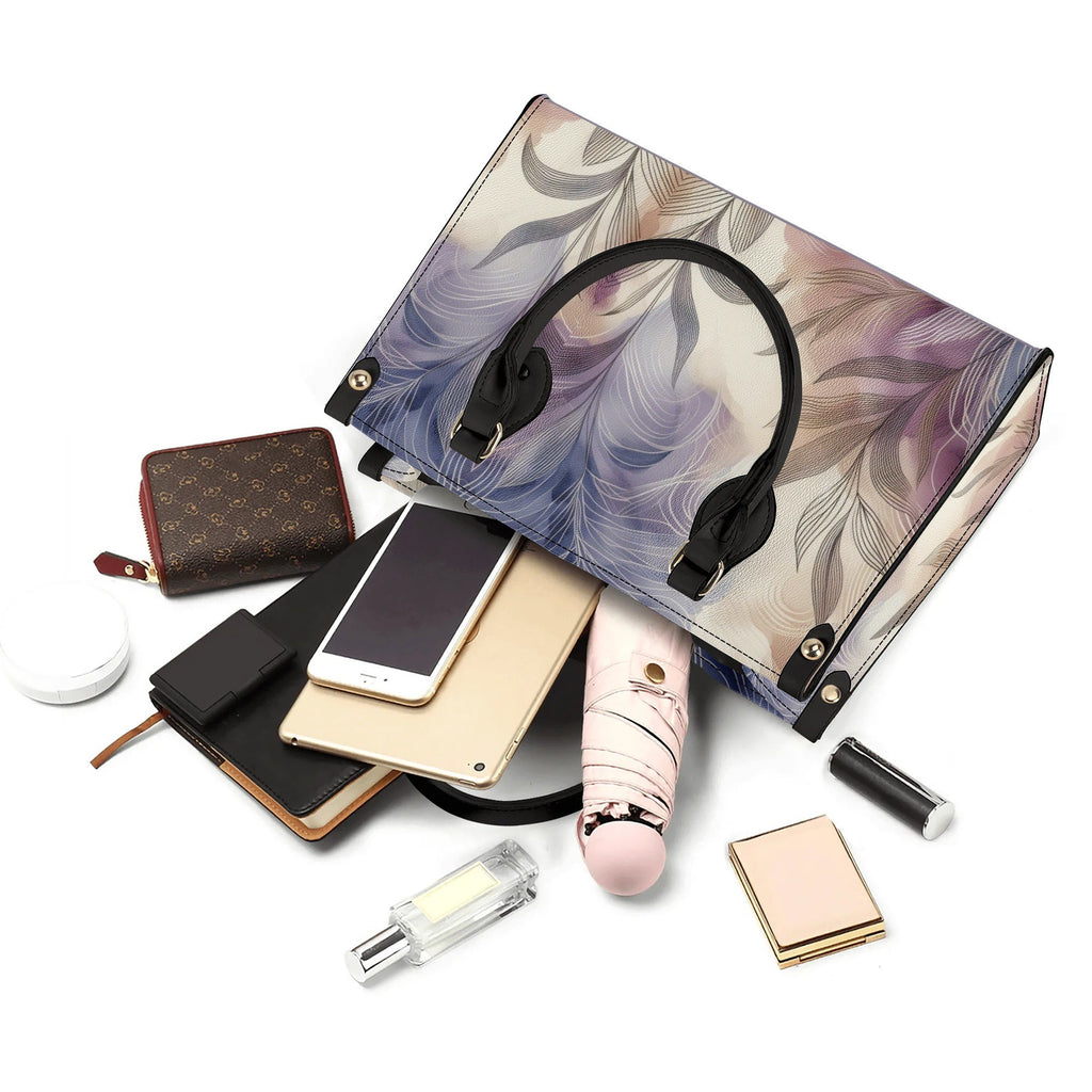 Floral-patterned handbag with various accessories on a white background