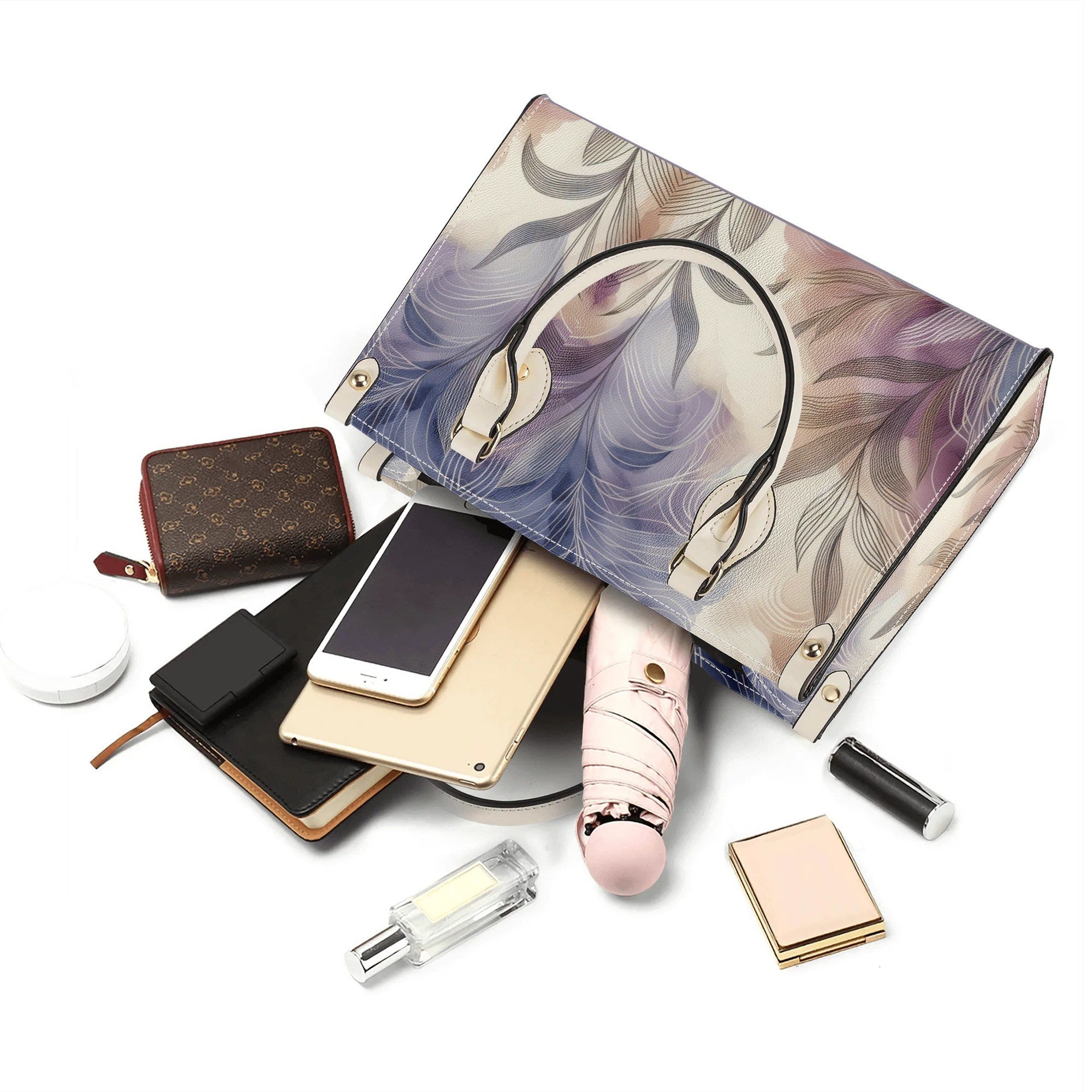 Marble-patterned handbag with phone, wallet, and other accessories on a white background