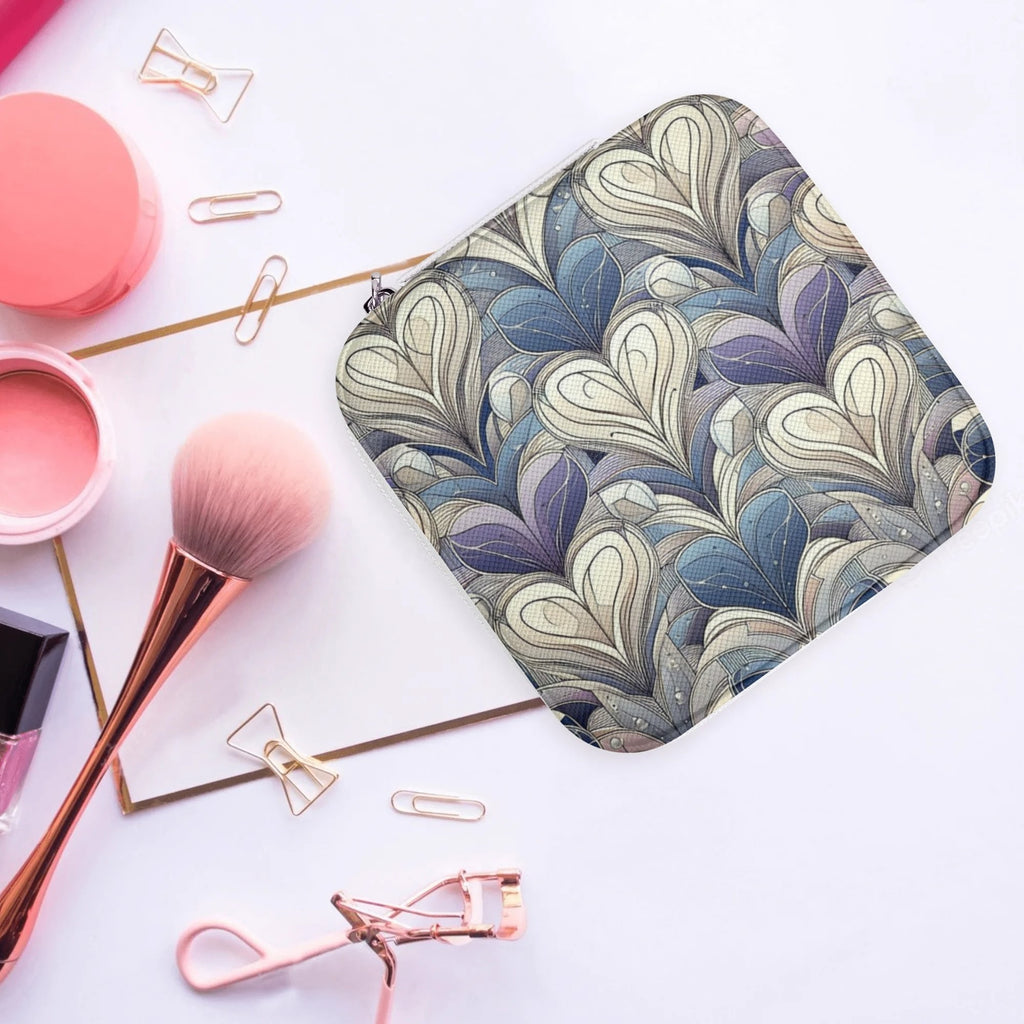Patterned pouch with makeup tools on a white background