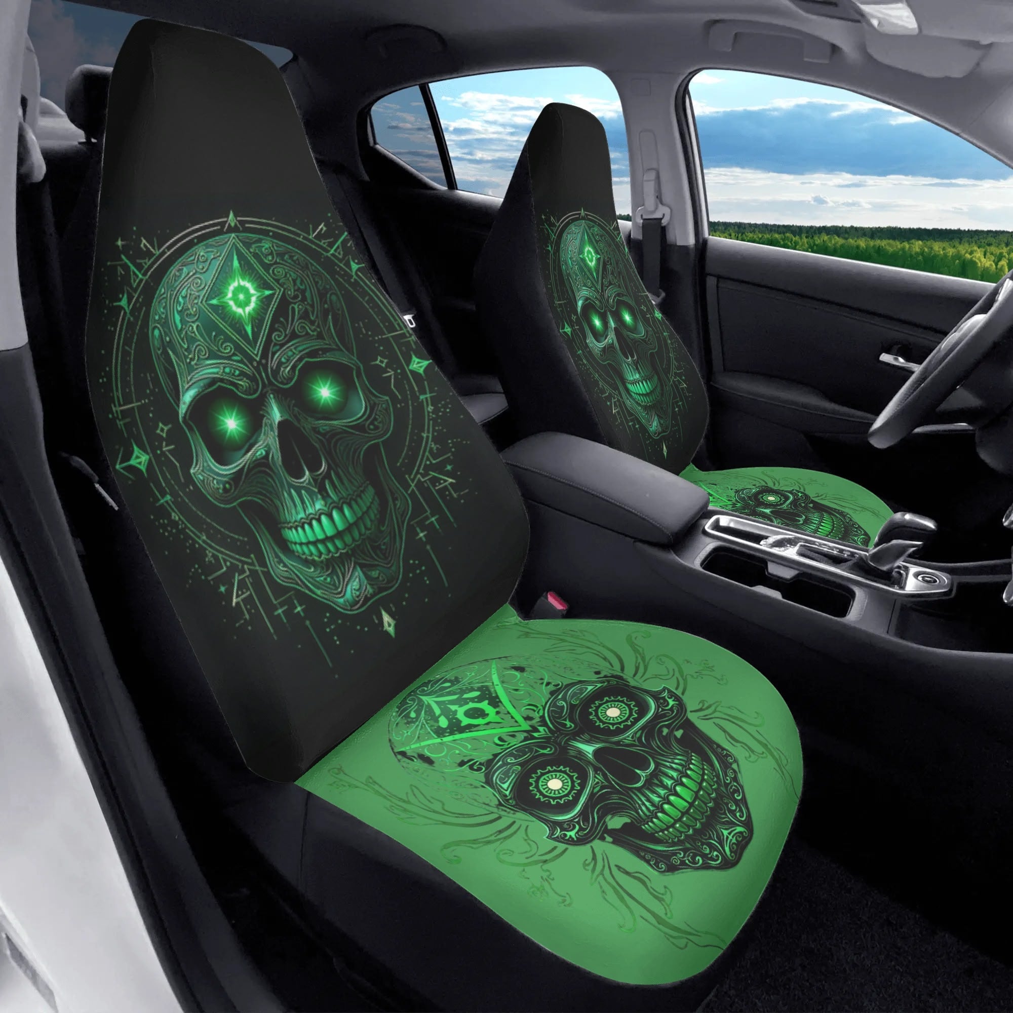 Car seat covers with green skull design in a vehicle interior.