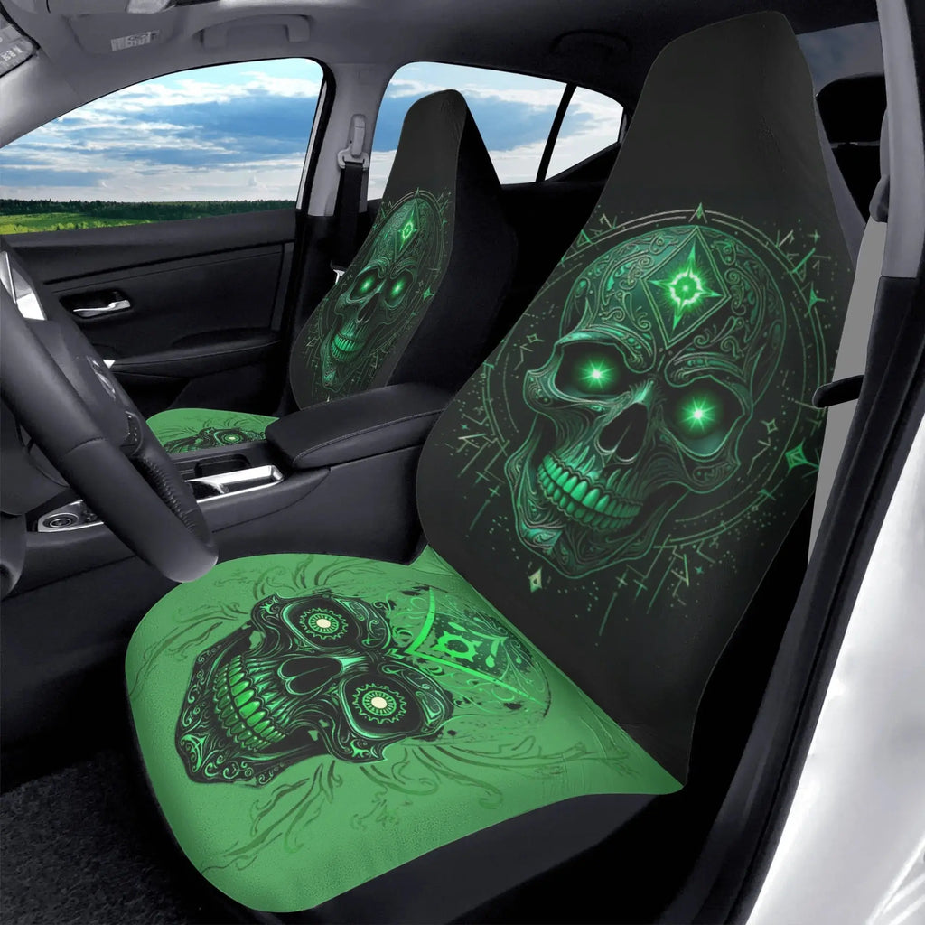Car seat covers with green skull design in a vehicle interior.